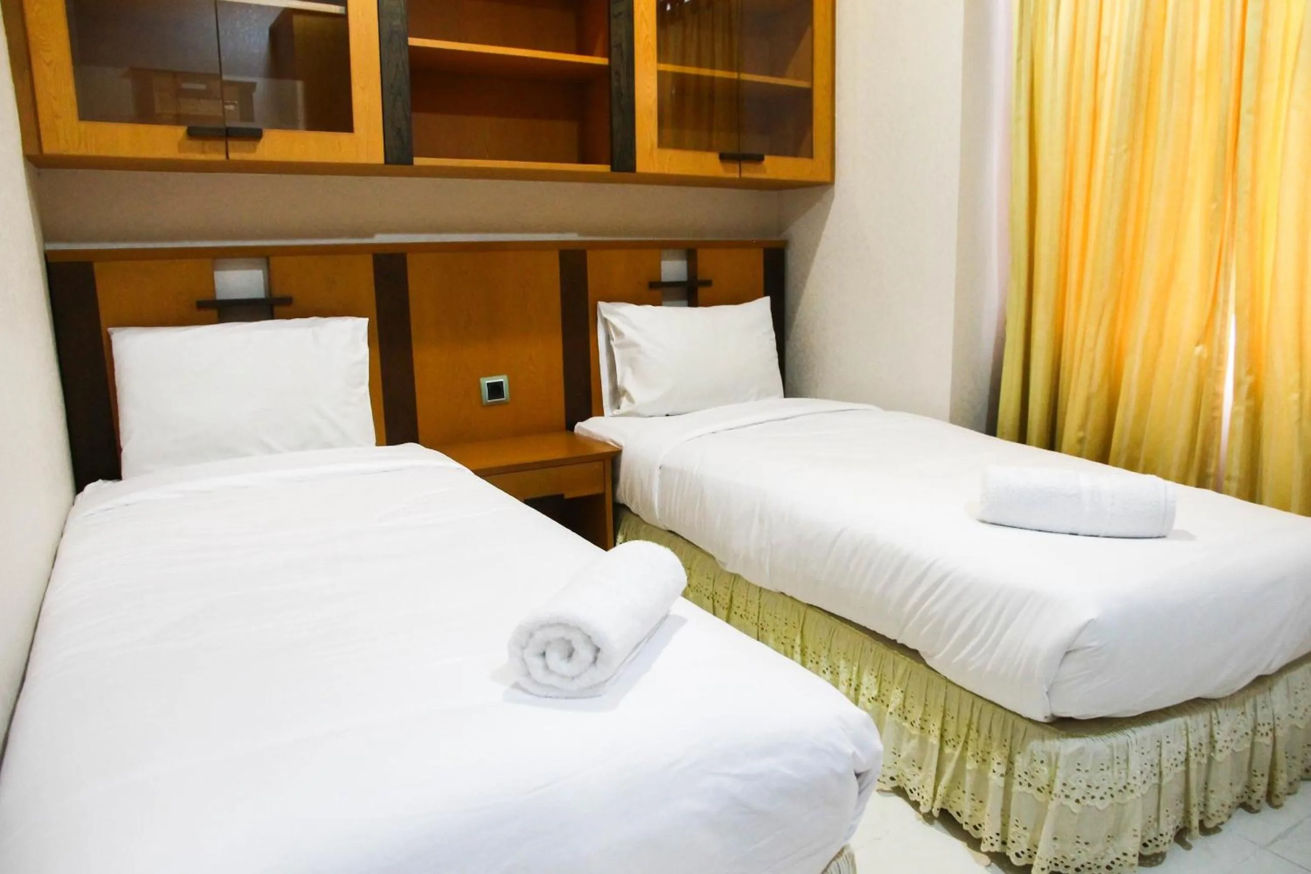Bed in 2BR Family Sudirman Tower Condominium Apartment near Plaza Semanggi By Travelio