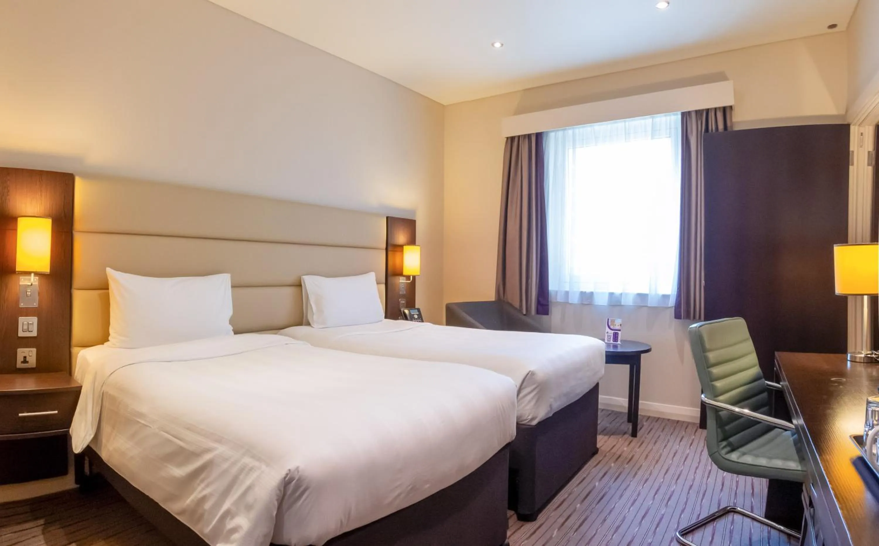 Bed in Premier Inn Doha Airport