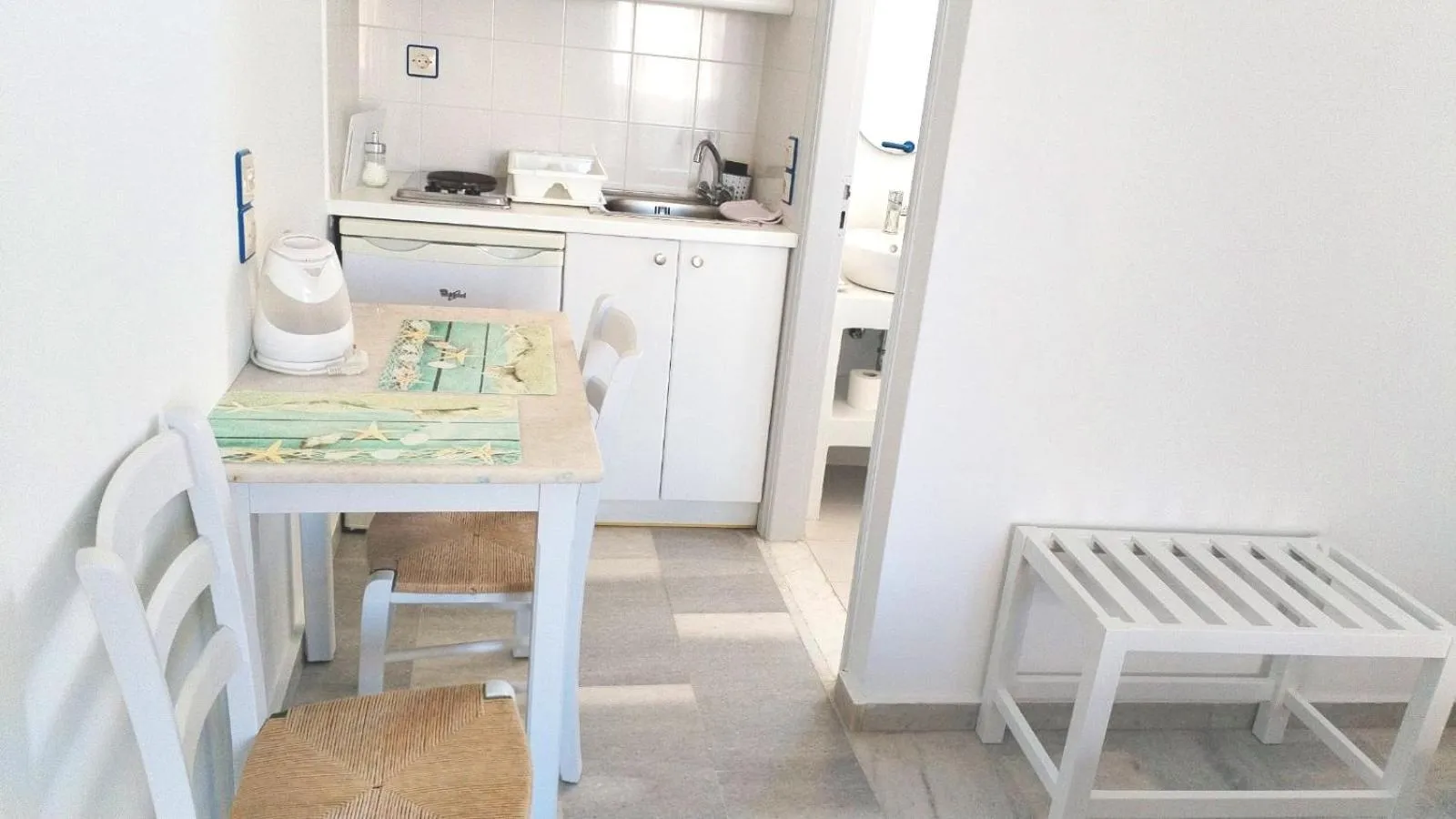 Kitchen or kitchenette in Nostos Studios at Saint George beach Agios Georgios Chora Naxos town