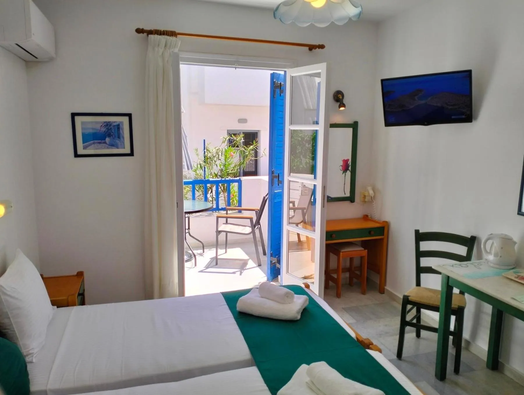 TV and multimedia, Bed in Nostos Studios at Saint George beach Agios Georgios Chora Naxos town