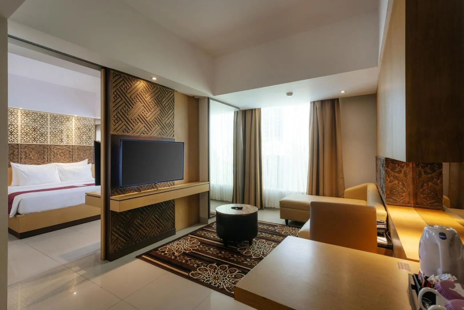 Communal lounge/ TV room, Bed in Horison Ultima Seminyak Bali - CHSE Certified