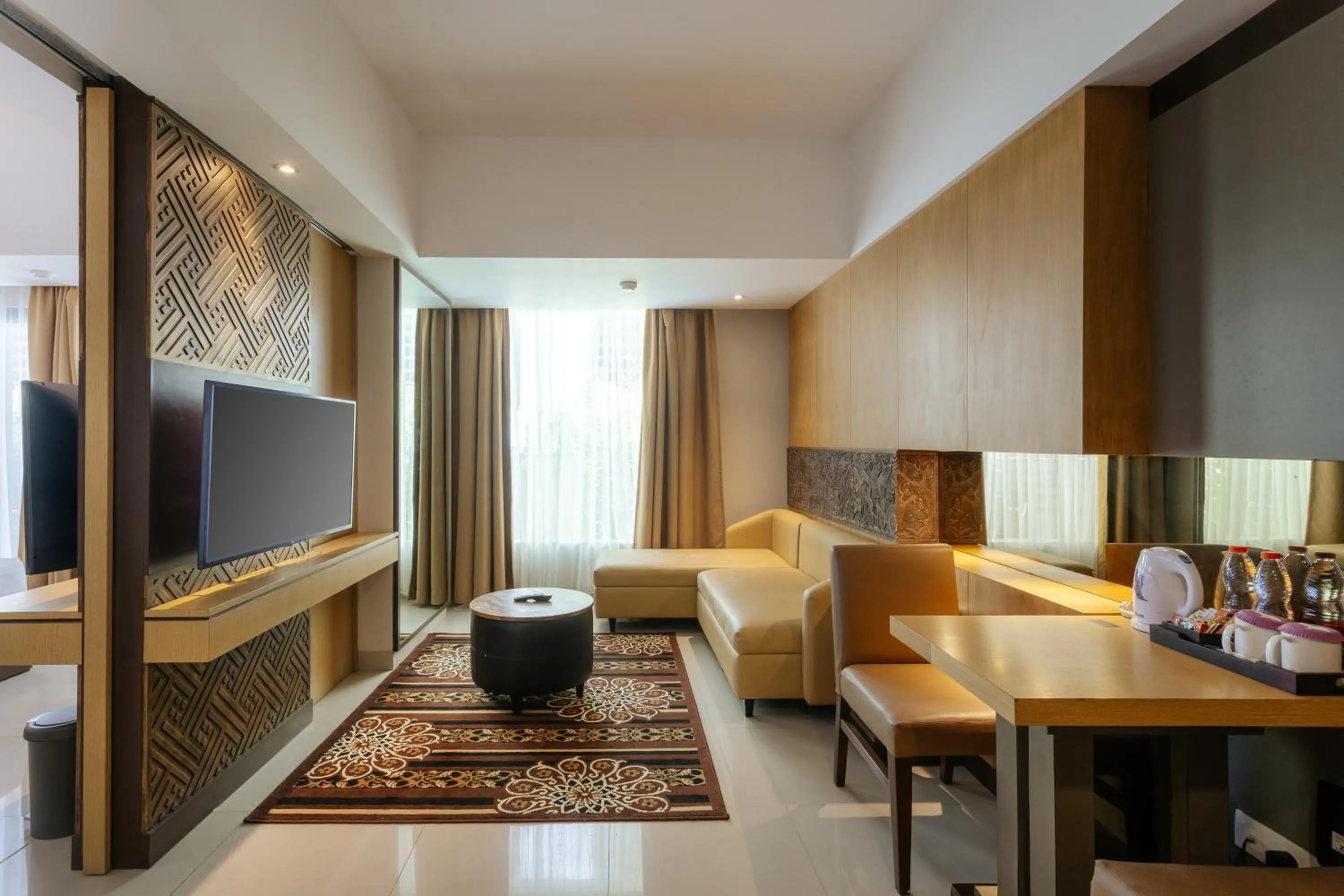 Communal lounge/ TV room in Horison Ultima Seminyak Bali - CHSE Certified