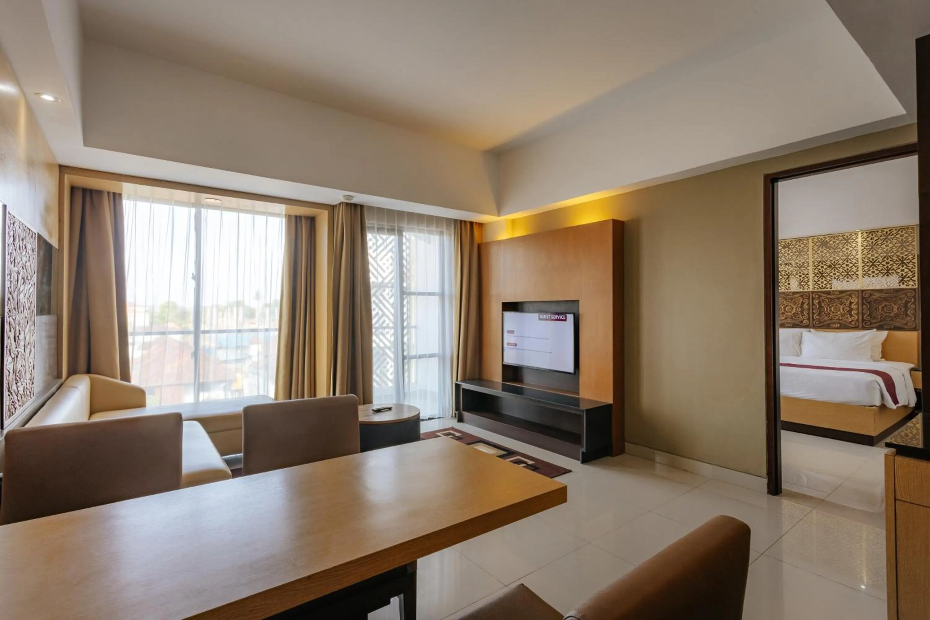 Communal lounge/ TV room, Bed in Horison Ultima Seminyak Bali - CHSE Certified