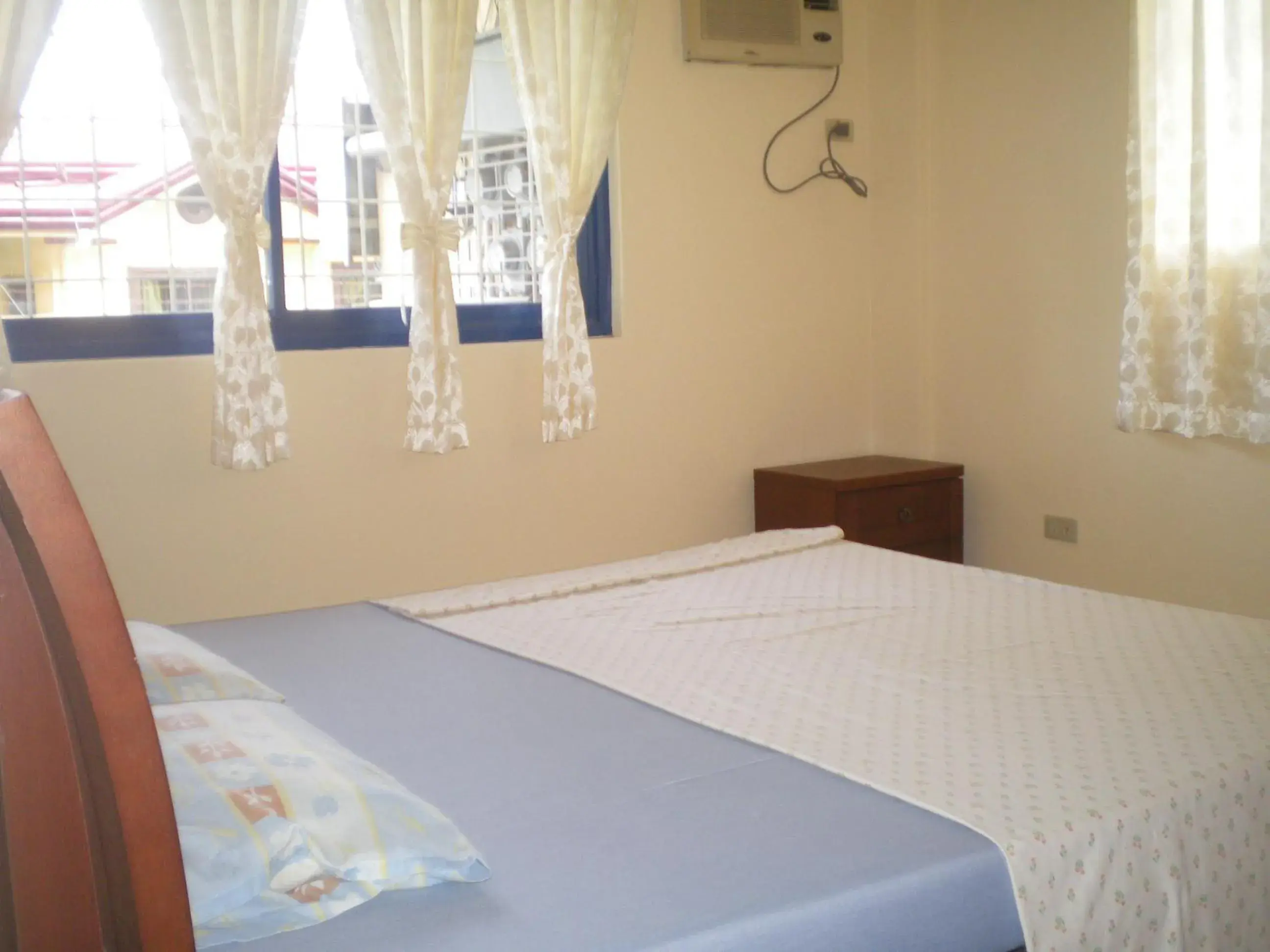 Bed in Dumaguete Springs Apartment