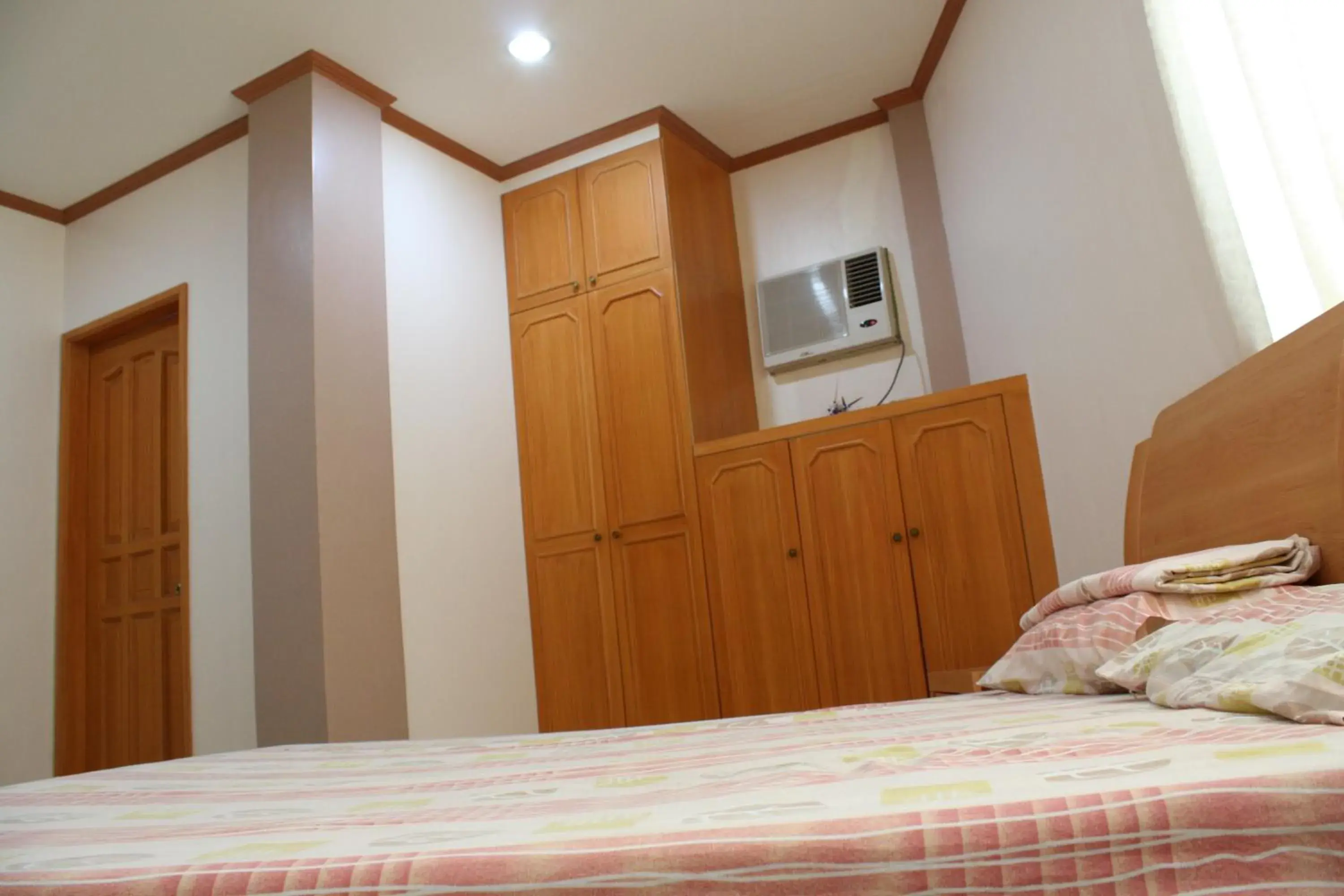 Bed in Dumaguete Springs Apartment