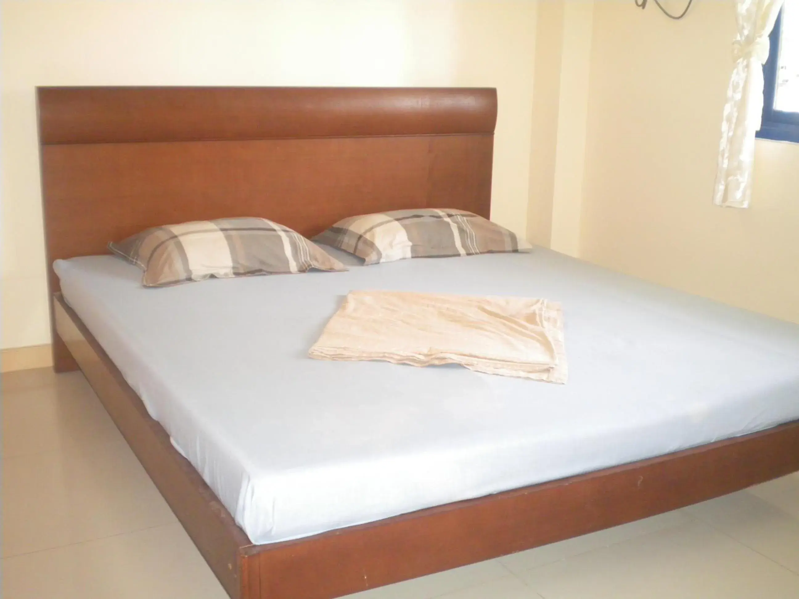 Bed in Dumaguete Springs Apartment