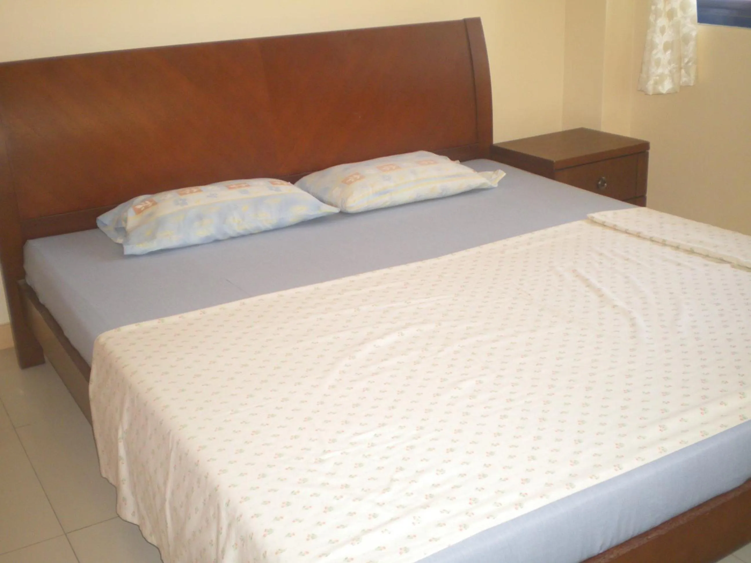 Bed in Dumaguete Springs Apartment