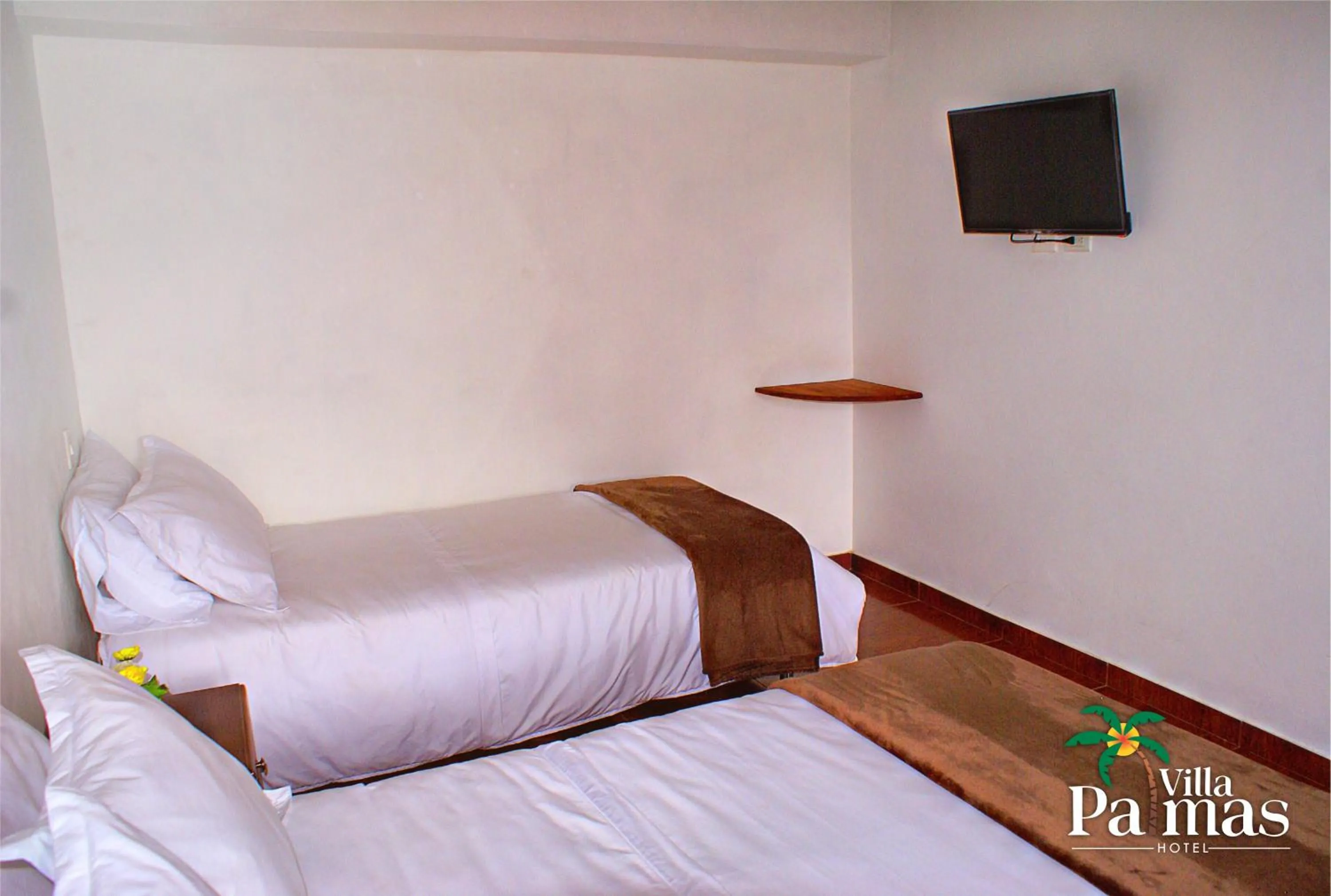 Bed in Hotel Villa Palmas
