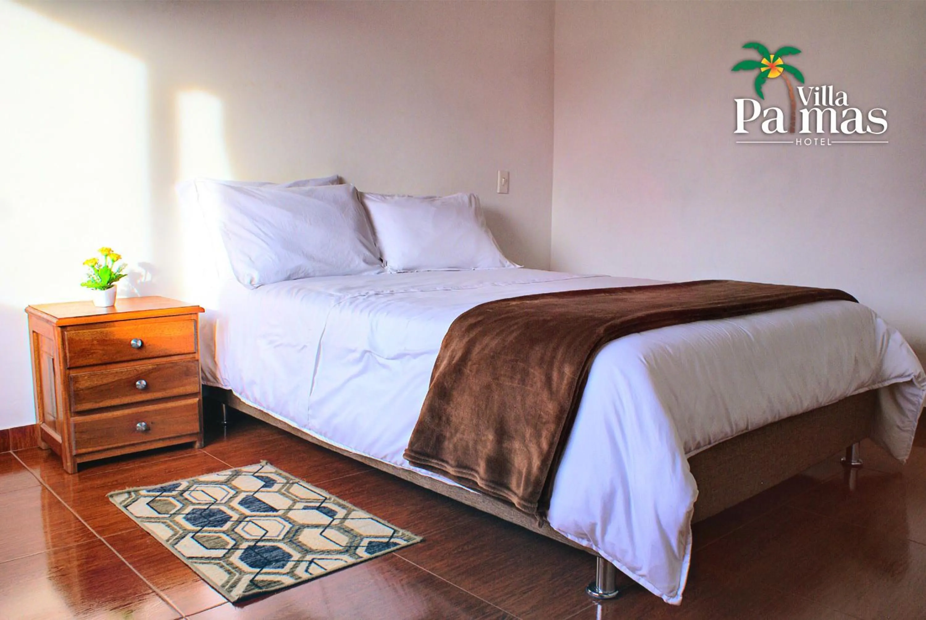 Bed in Hotel Villa Palmas