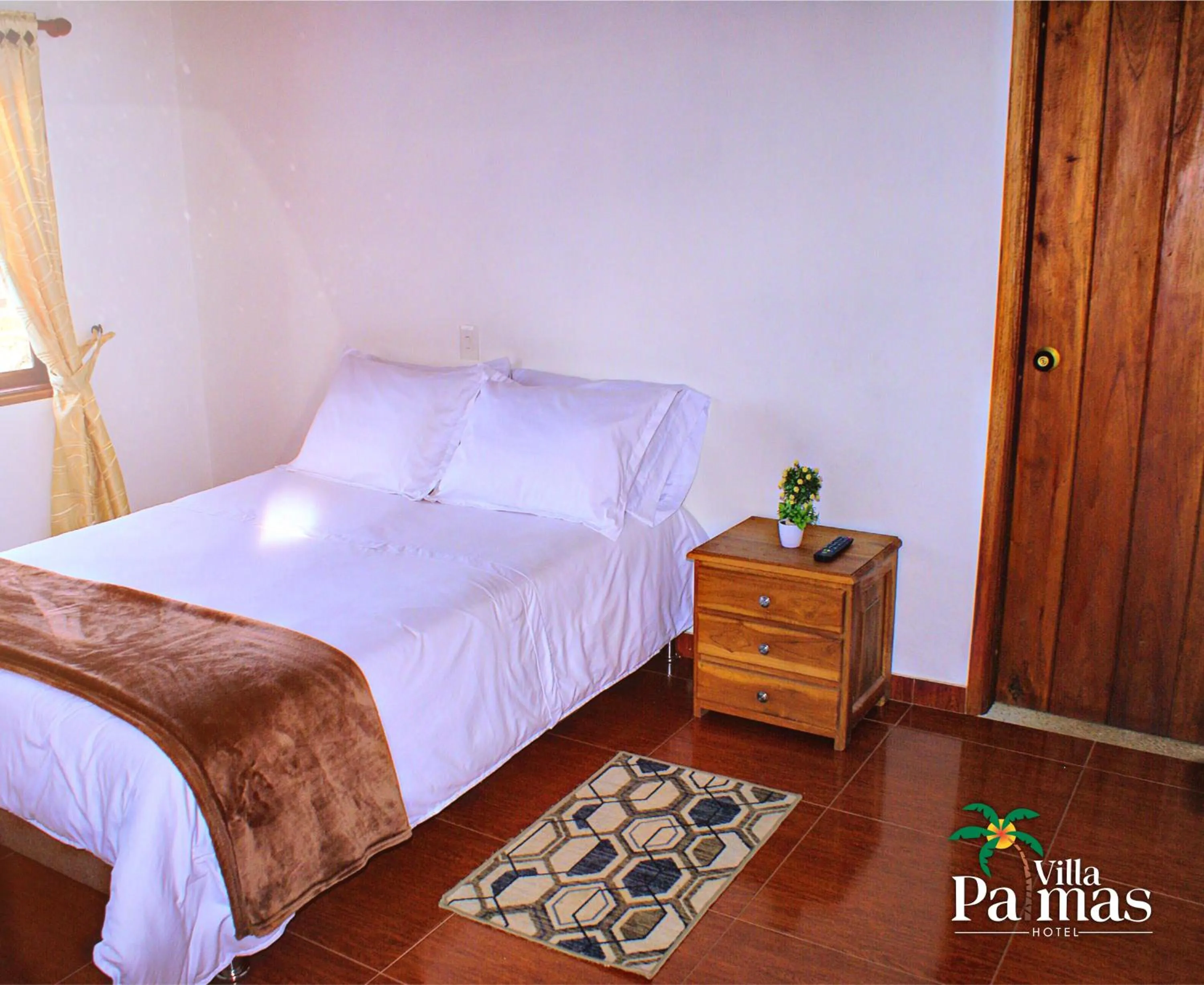Bed in Hotel Villa Palmas