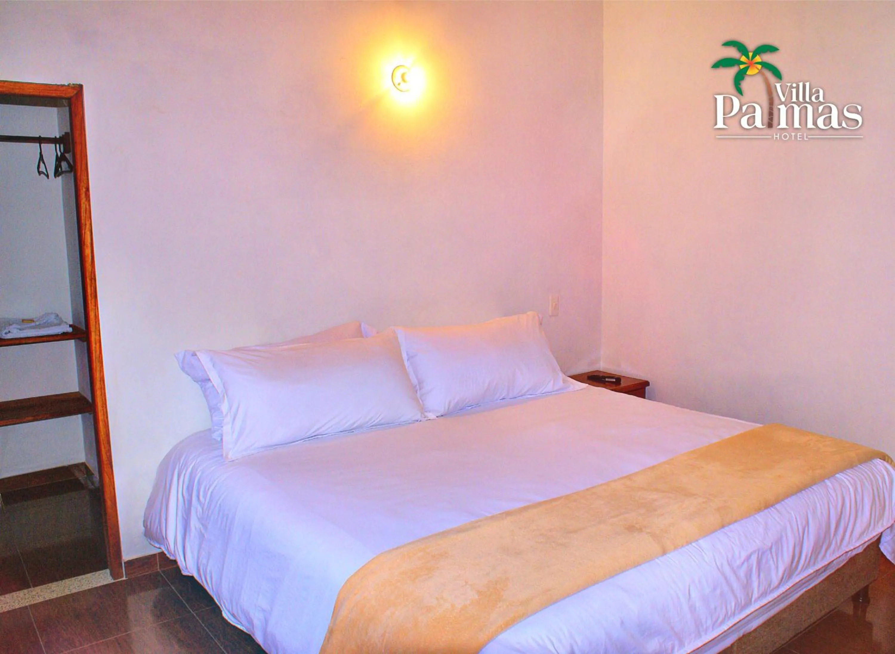 Bed in Hotel Villa Palmas