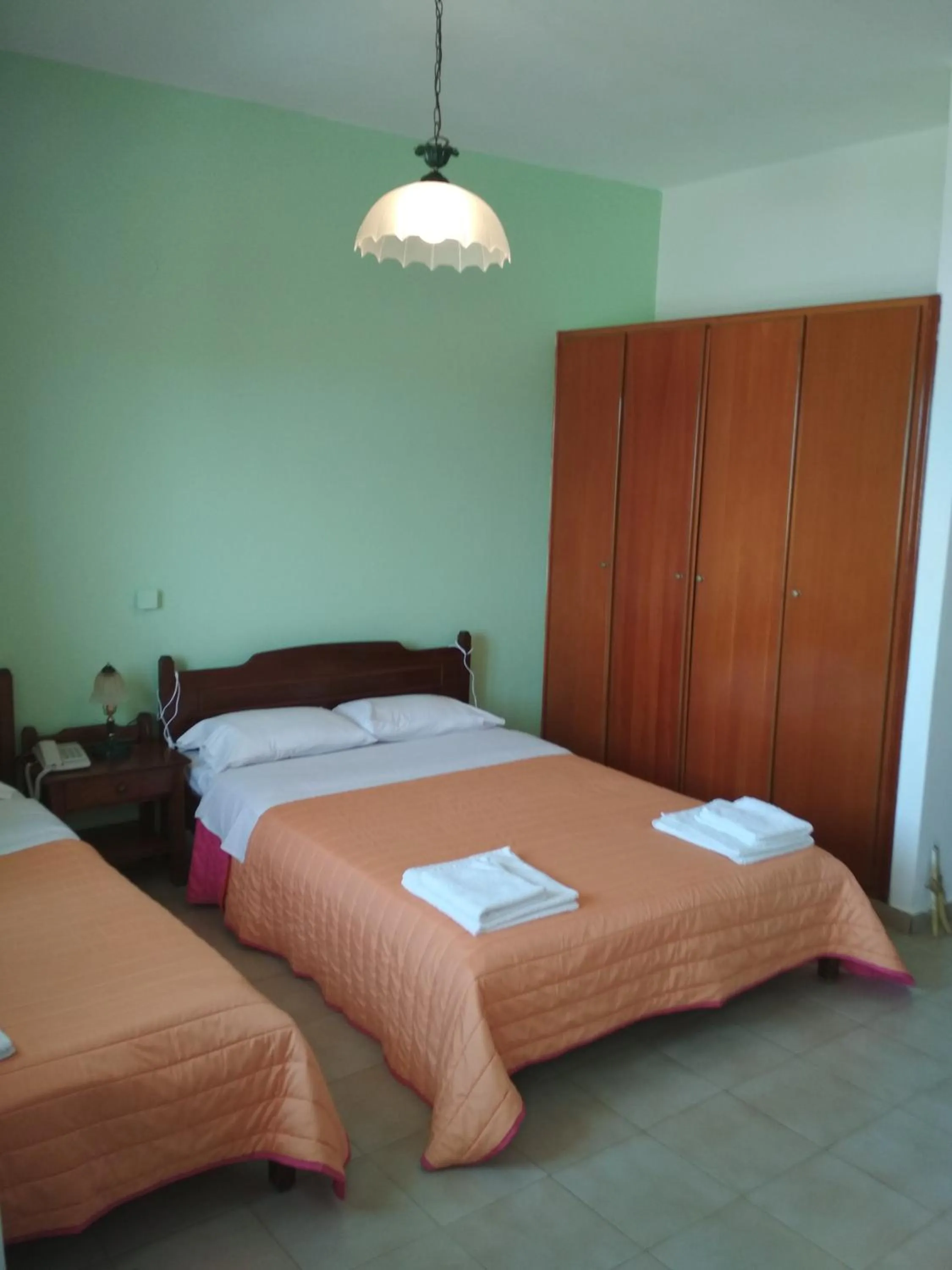 Bed in Flamingo Apartments