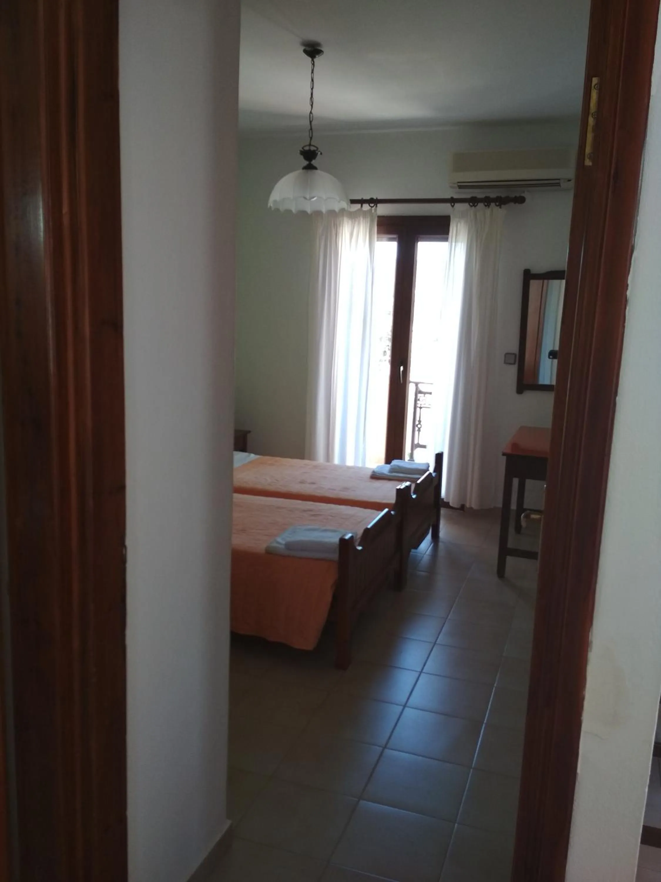 Bed in Flamingo Apartments