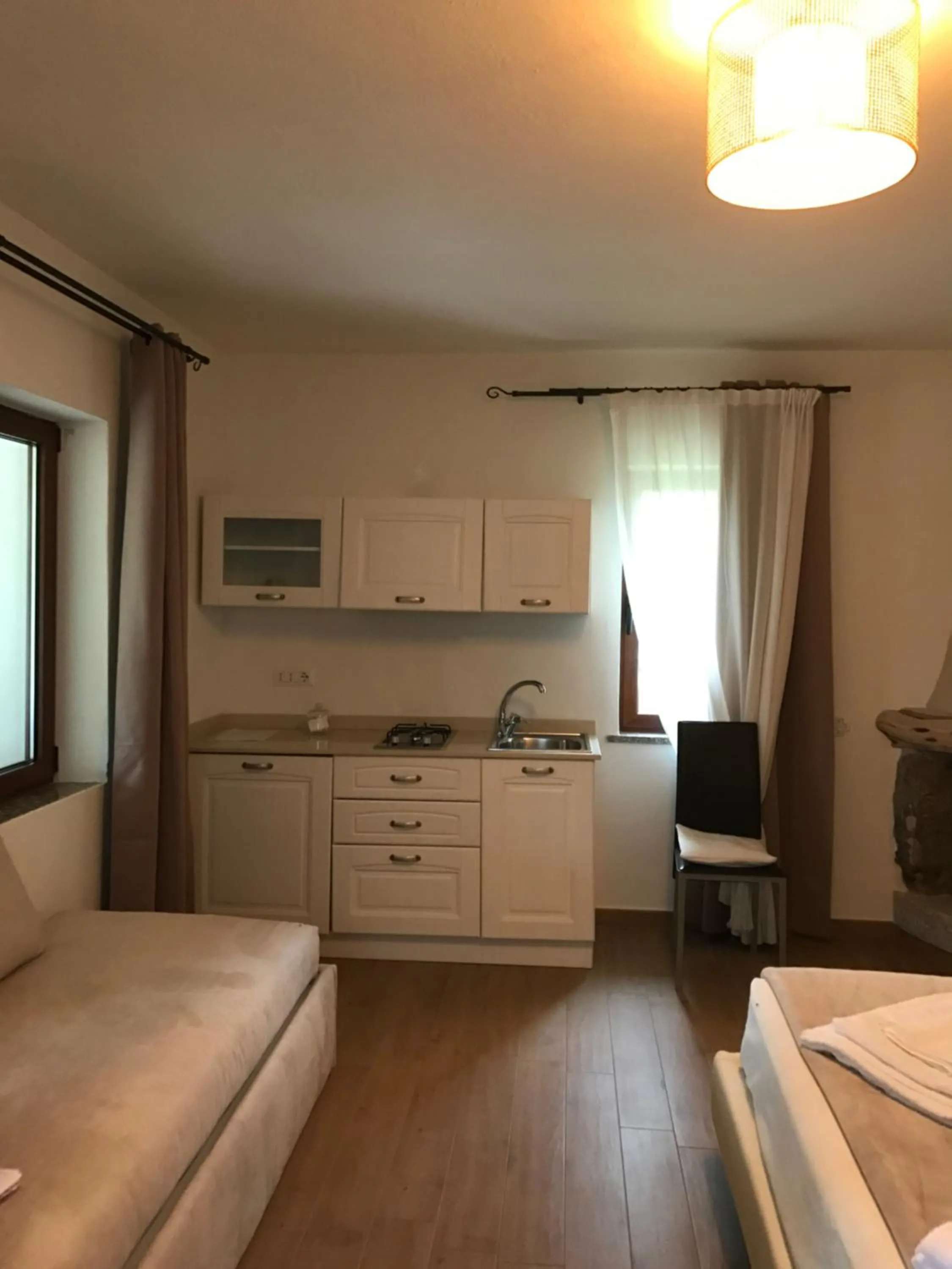 Photo of the whole room in Il Giardino di Daniela Apartments