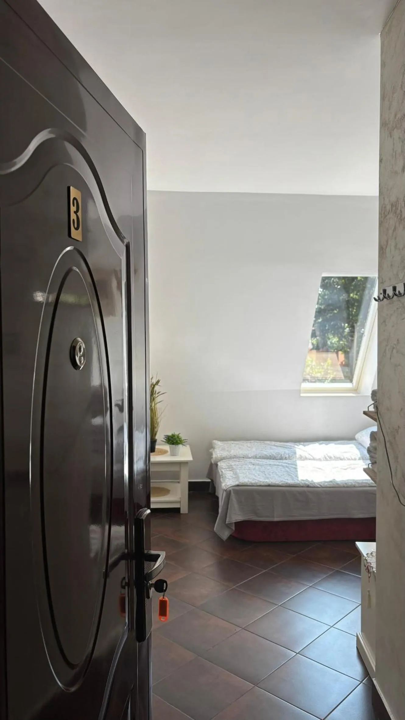 Bed in Pannónia Rooms and Apartments