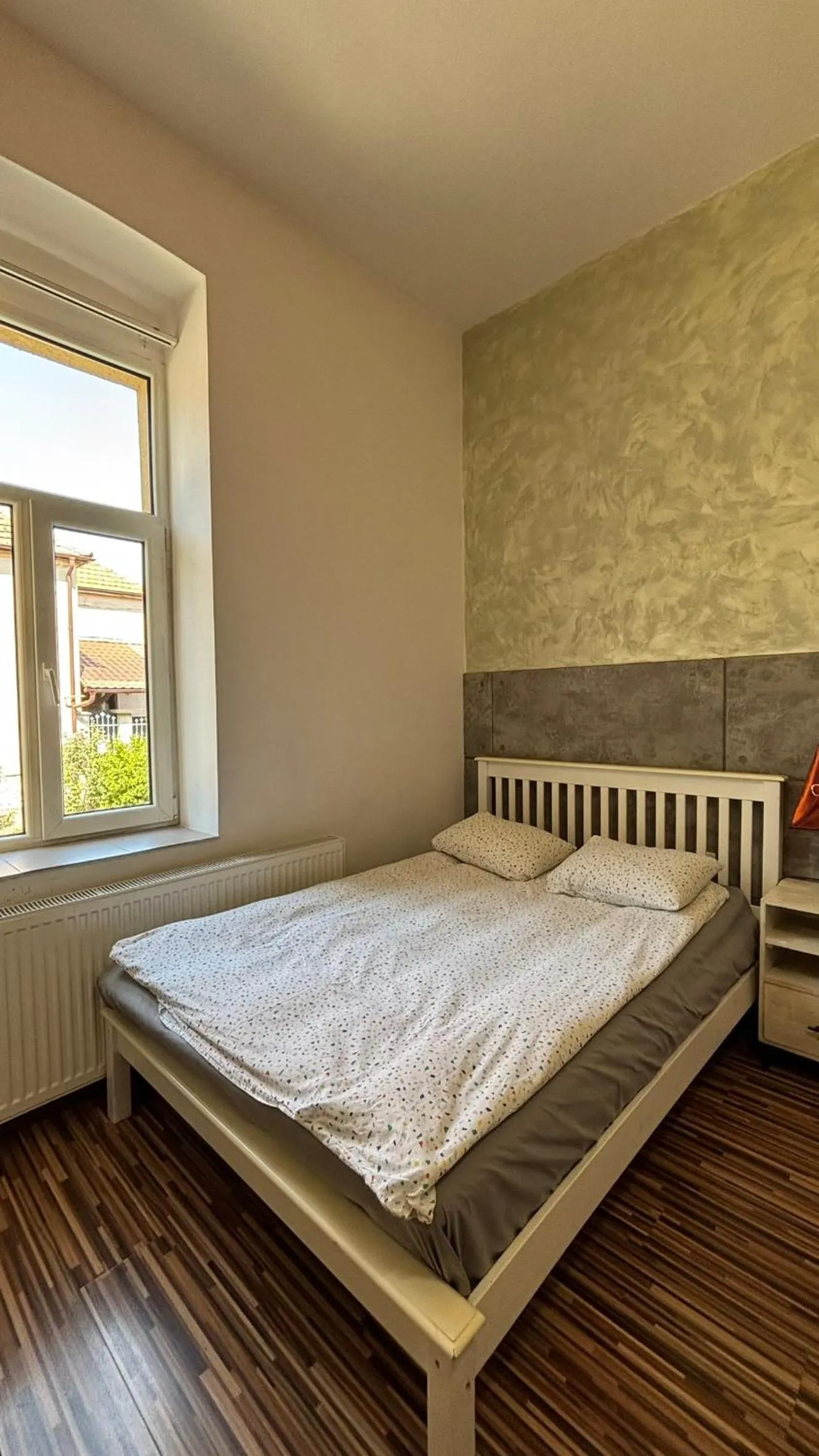 Bed in Pannónia Rooms and Apartments