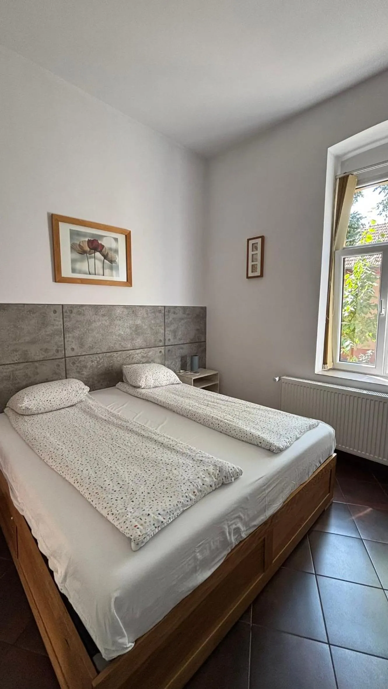 Bed in Pannónia Rooms and Apartments