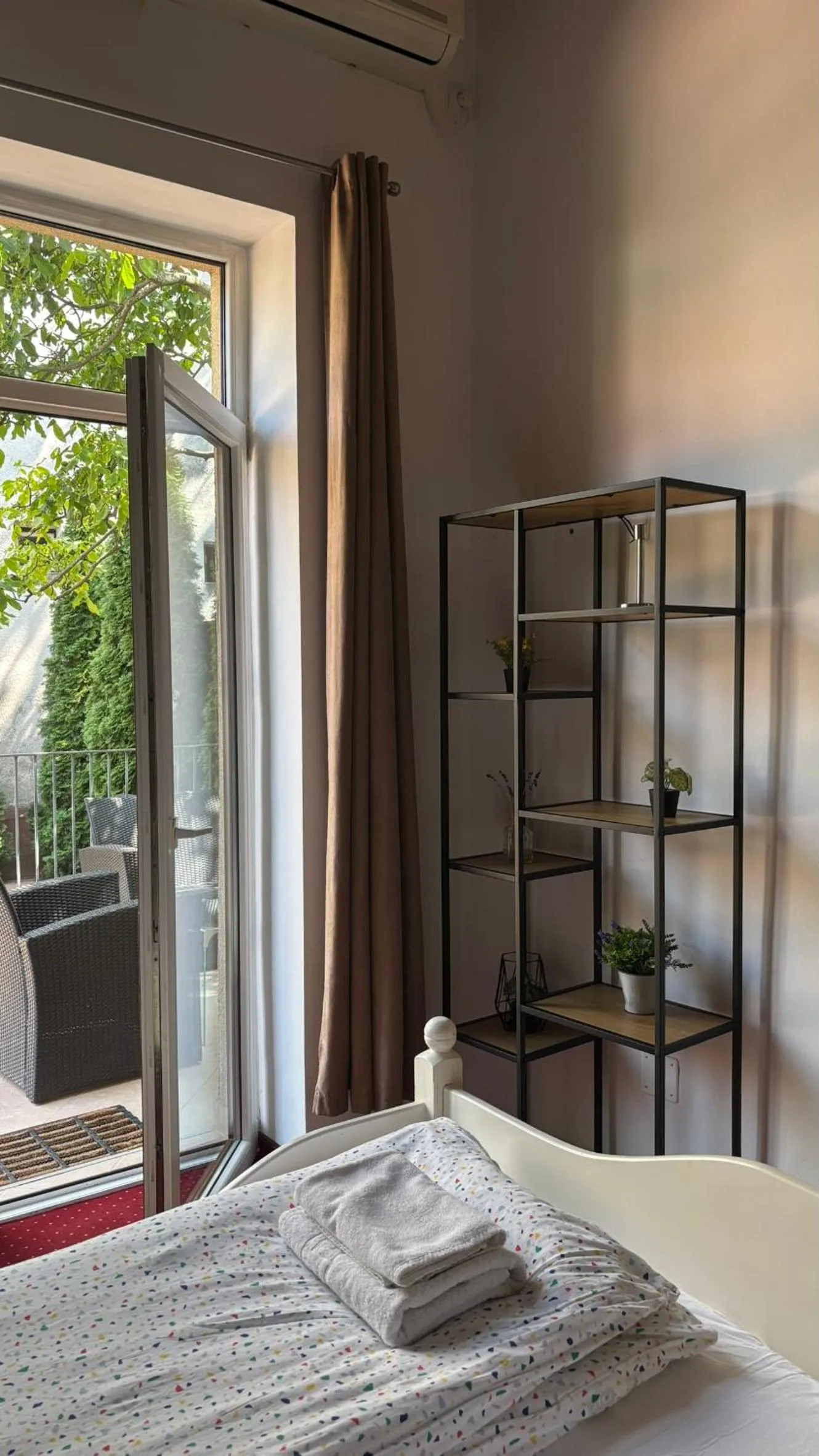 Bed in Pannónia Rooms and Apartments