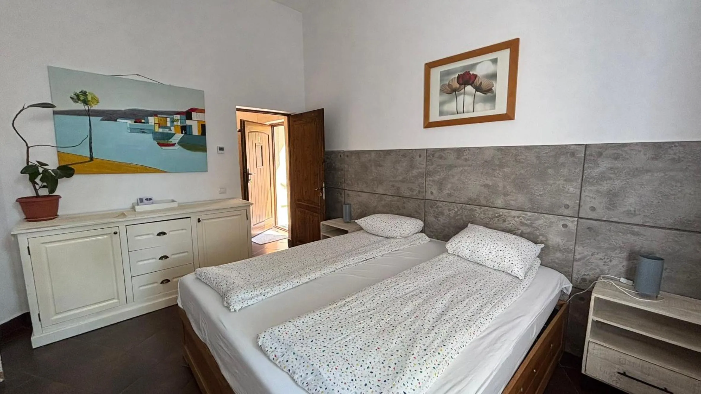 Bed in Pannónia Rooms and Apartments