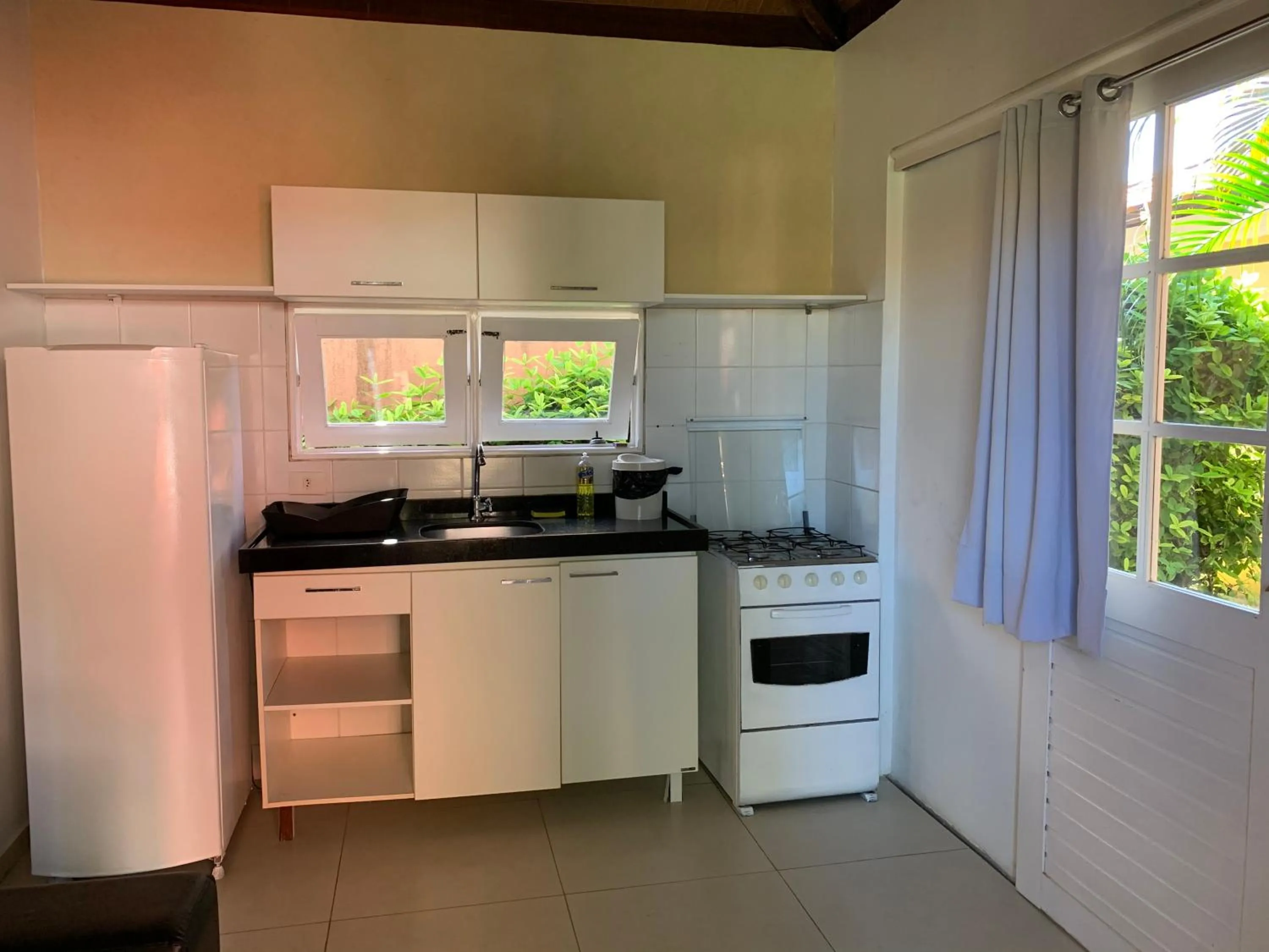 Kitchen or kitchenette in La Dolce Vita Flat & Pousada