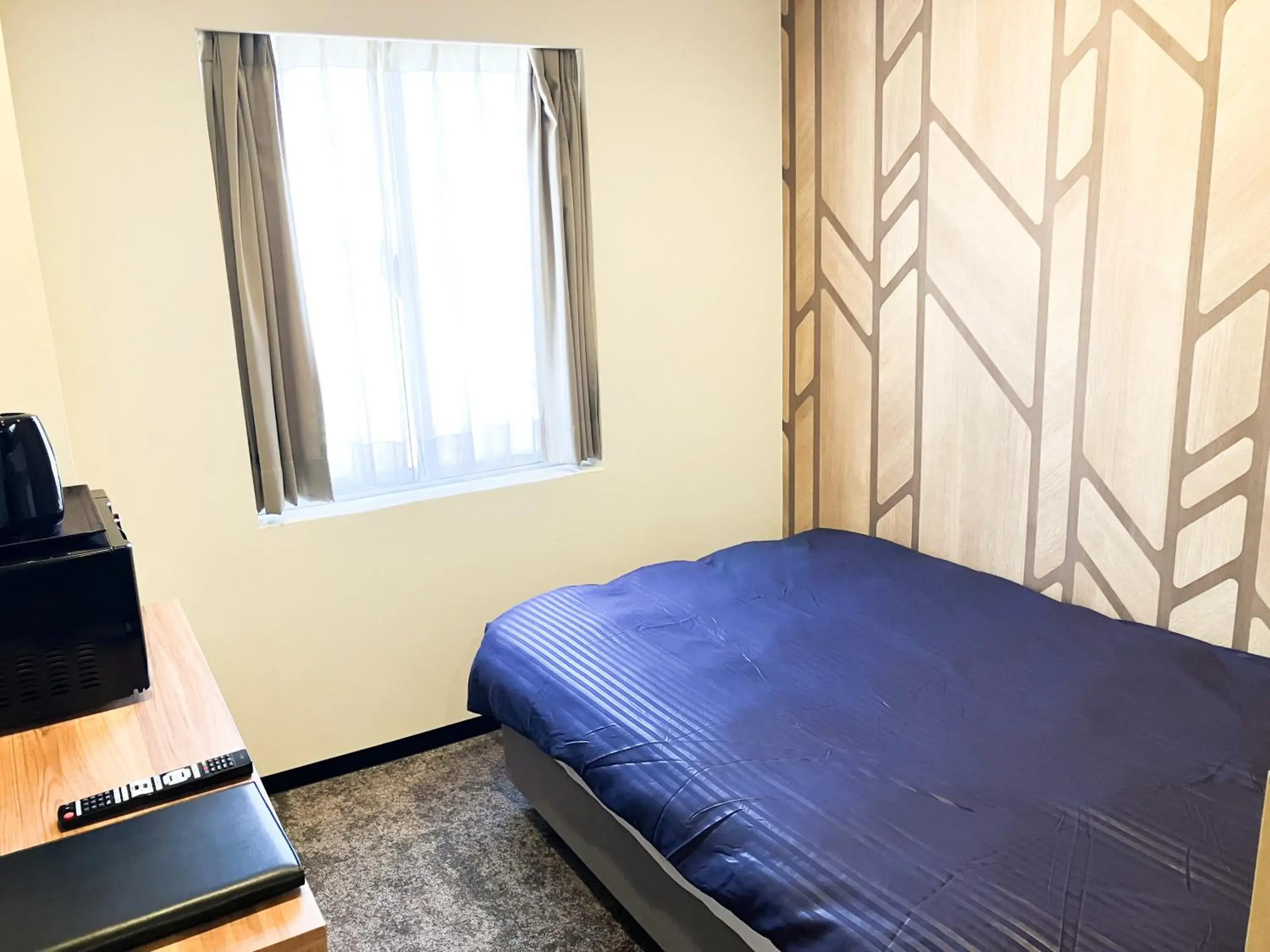 Bed in HOTEL LiVEMAX BUDGET Iyo Mishima Bed in HOTEL LiVEMAX BUDGET Iyo Mishima