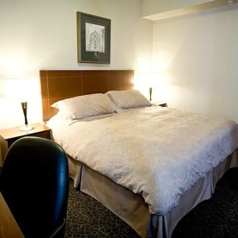 Bed in Heritage Inn & Suites - Brooks