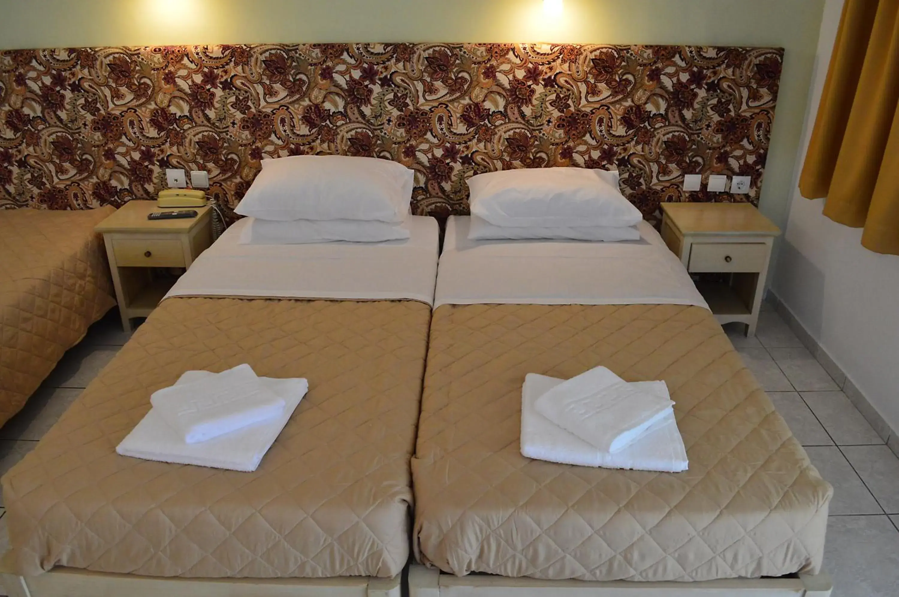 Bed in Alexandros Hotel Bed in Alexandros Hotel