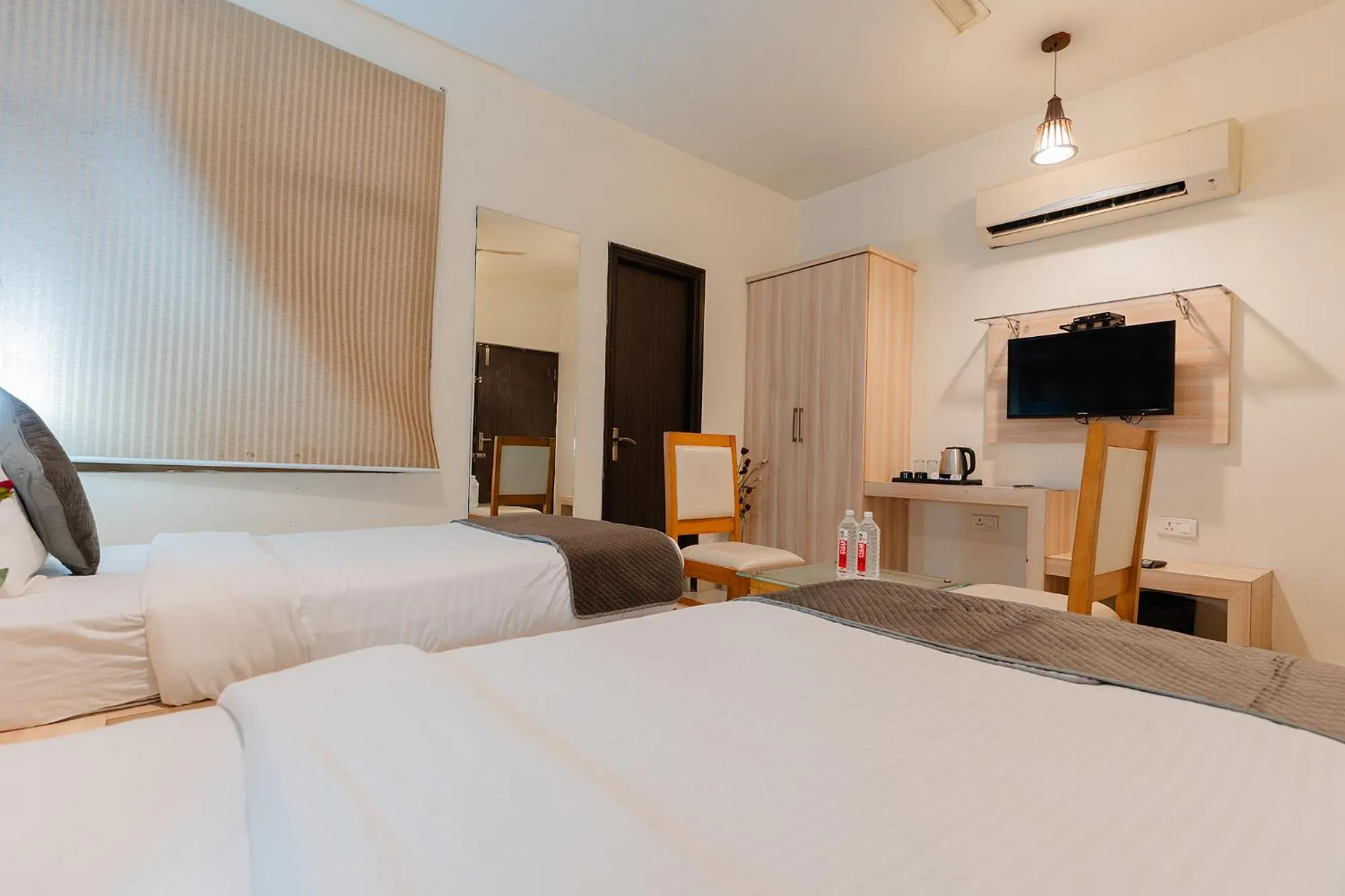 Bed in FabHotel Signature Inn