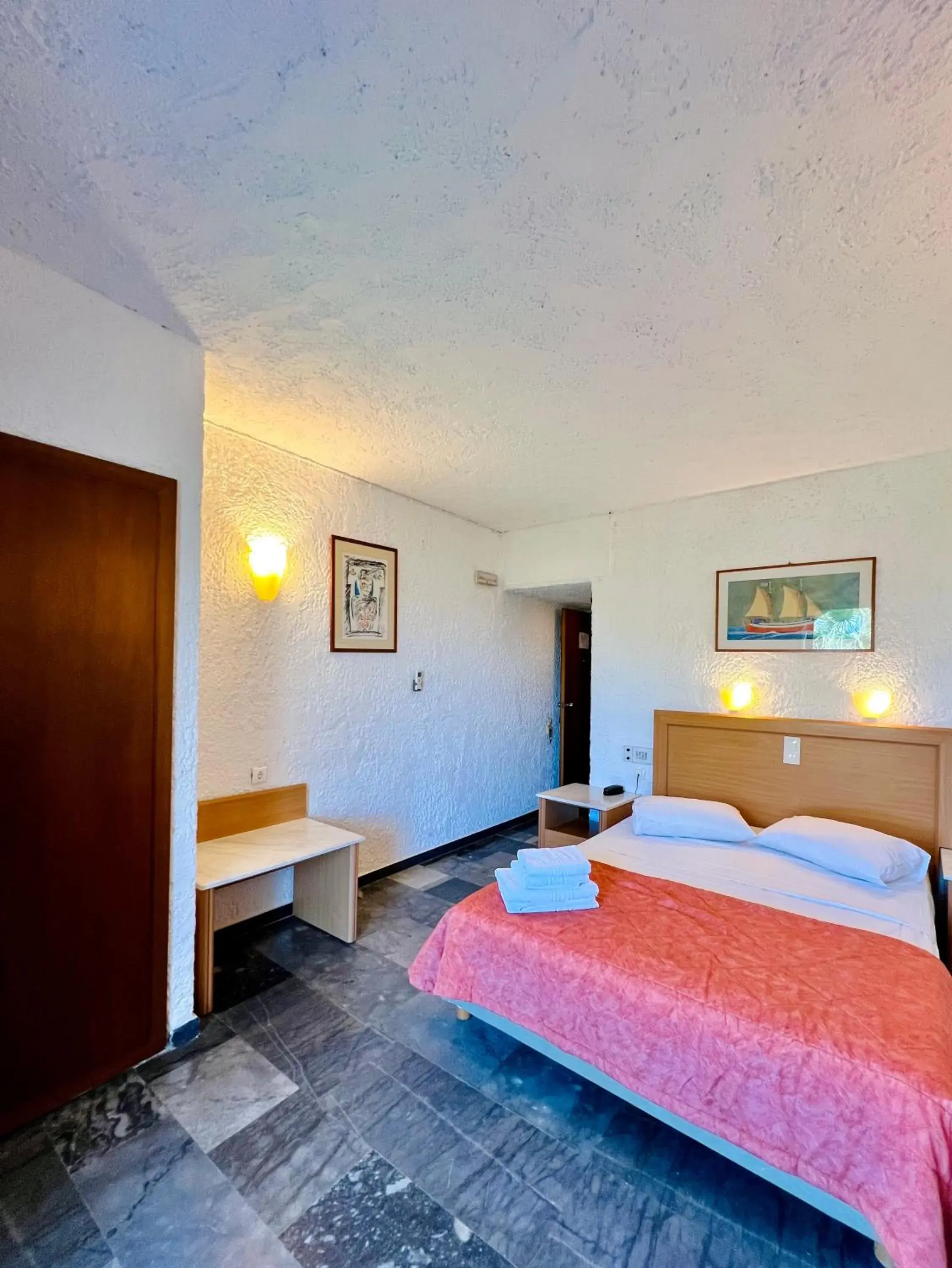 Bed in Karteros Hotel Bed in Karteros Hotel