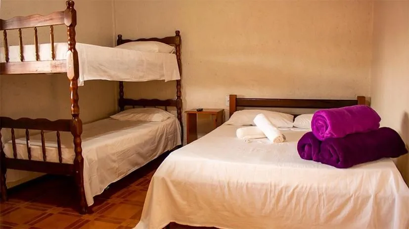 Bed in Pousada Halliny do Rosa