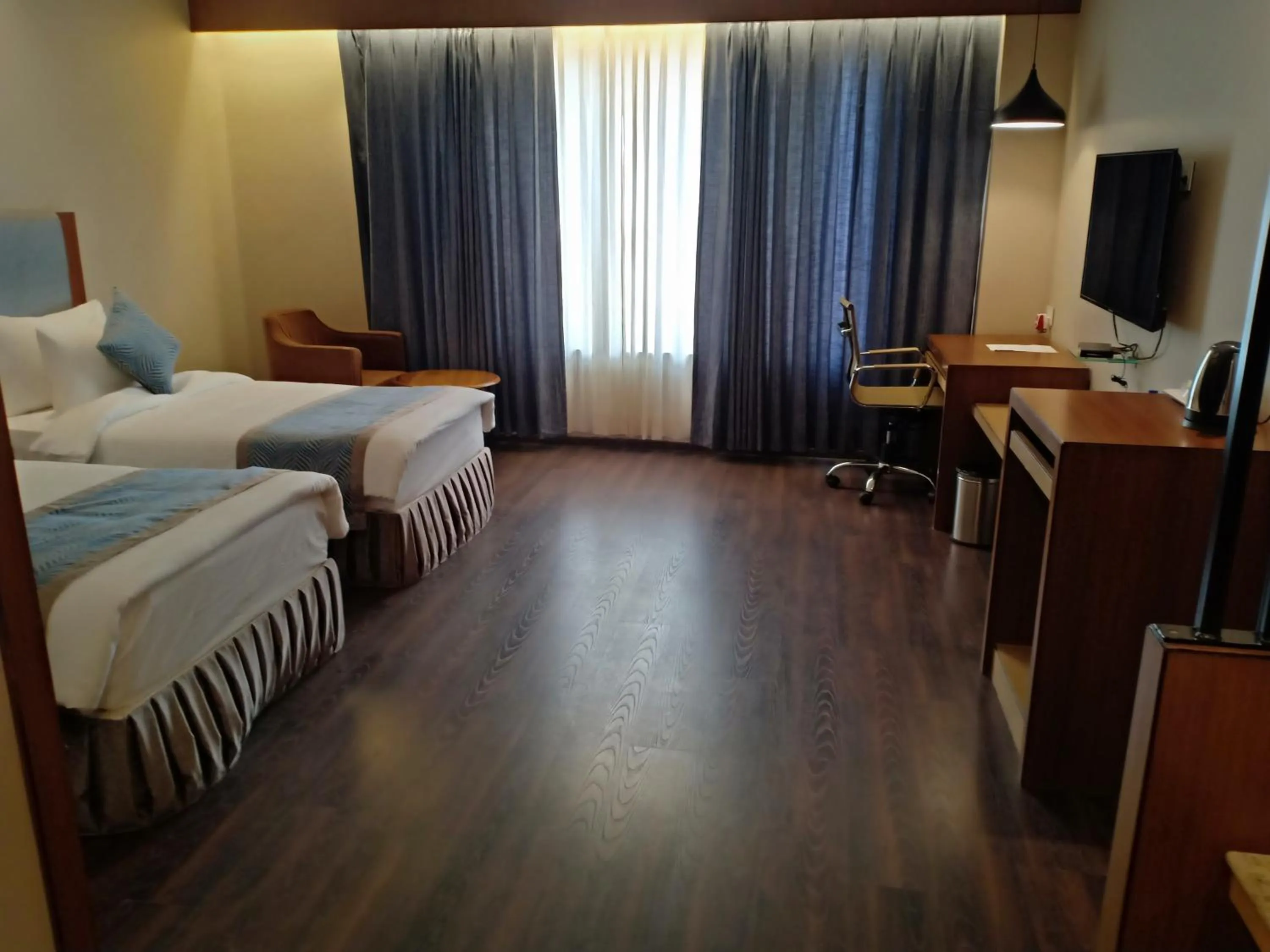 Bed in Pipul Padmaja Premium Hotel