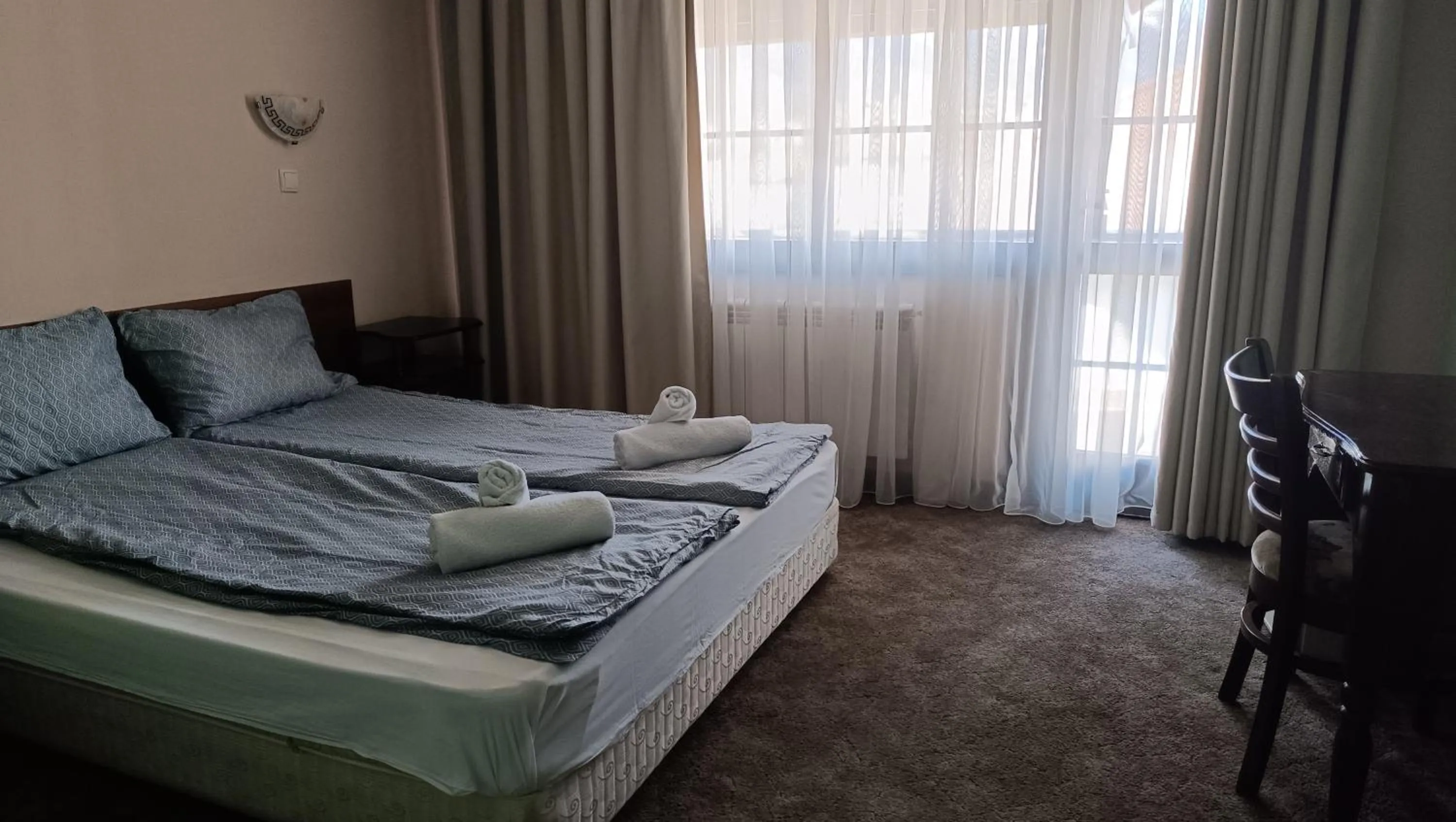 Bed in Hotel St. George Pobedonosets