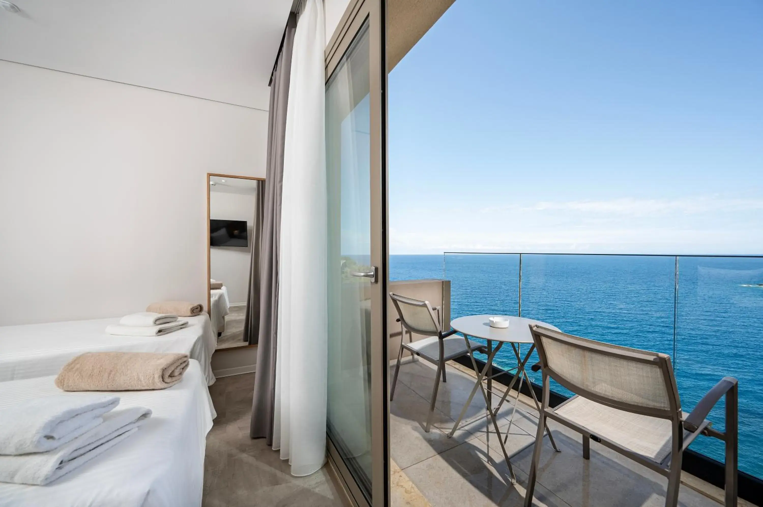 Bedroom, Bed in Athina Palace Resort & Spa Bedroom, Bed in Athina Palace Resort & Spa