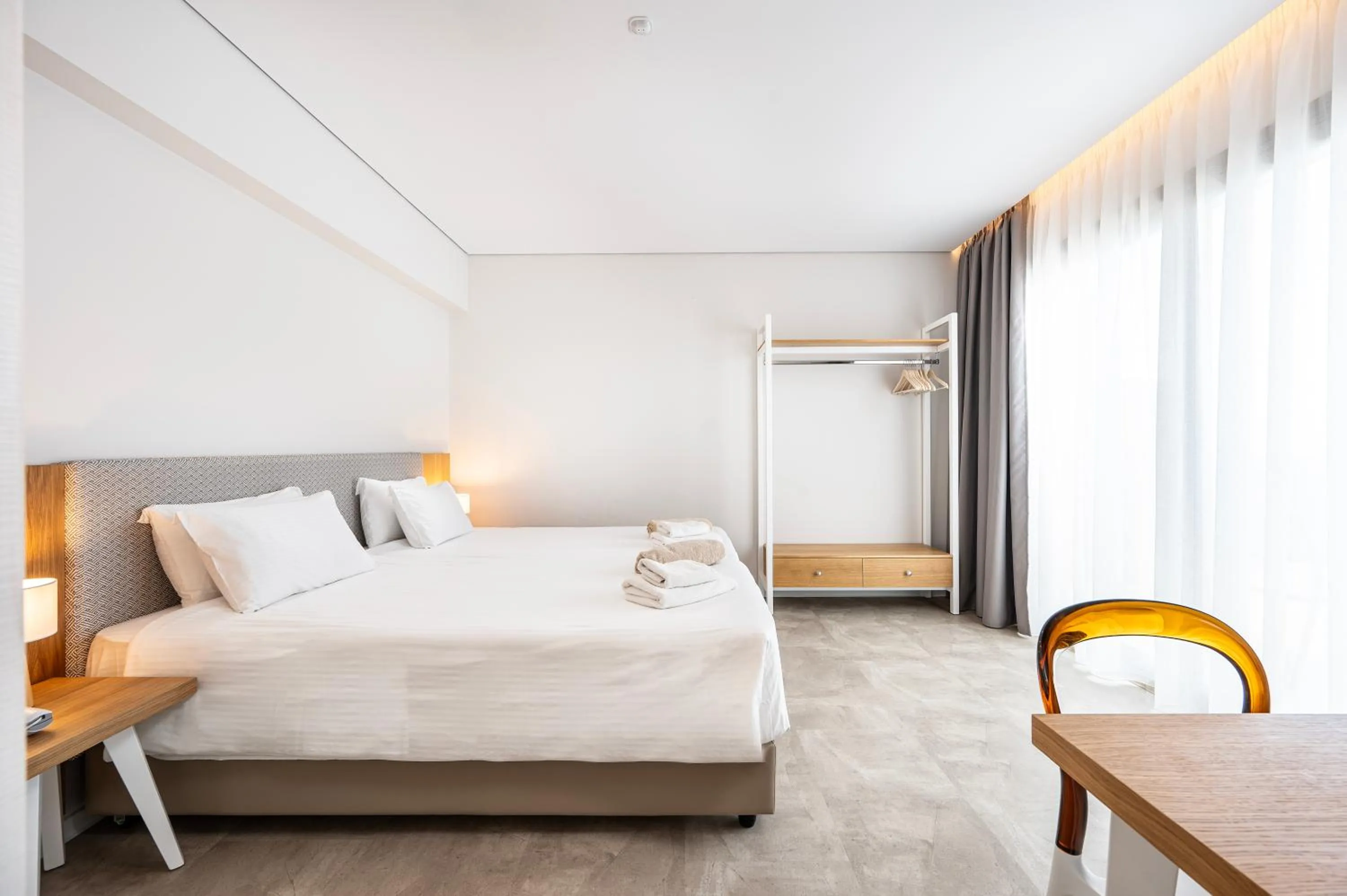 Bed in Athina Palace Resort & Spa