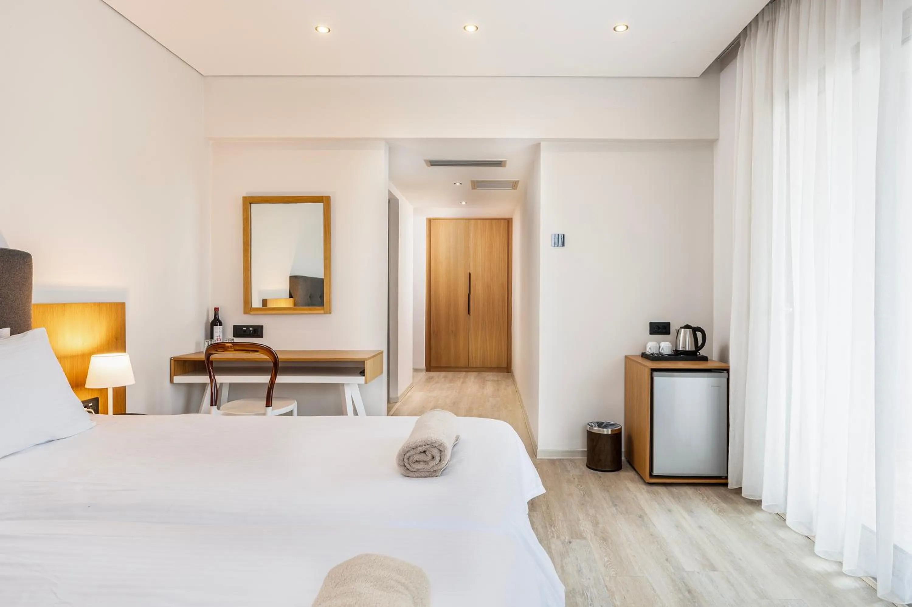 Bed in Athina Palace Resort & Spa