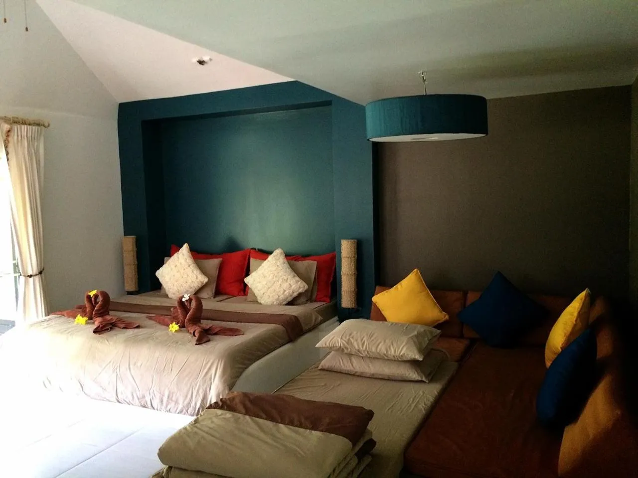 Bed in Phayam Cottage Resort