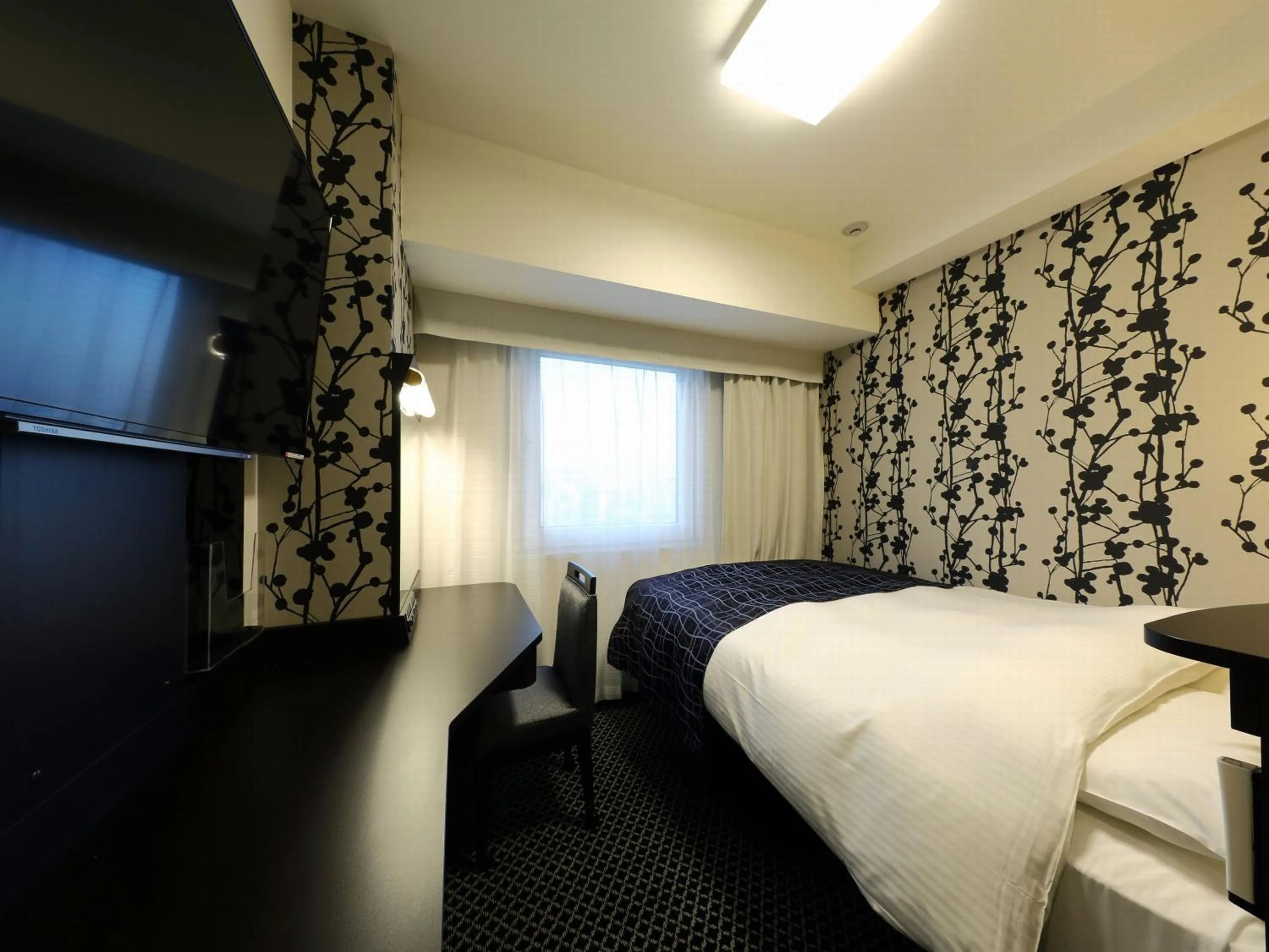 Photo of the whole room, Bed in APA Hotel Ueno Inaricho Ekikita