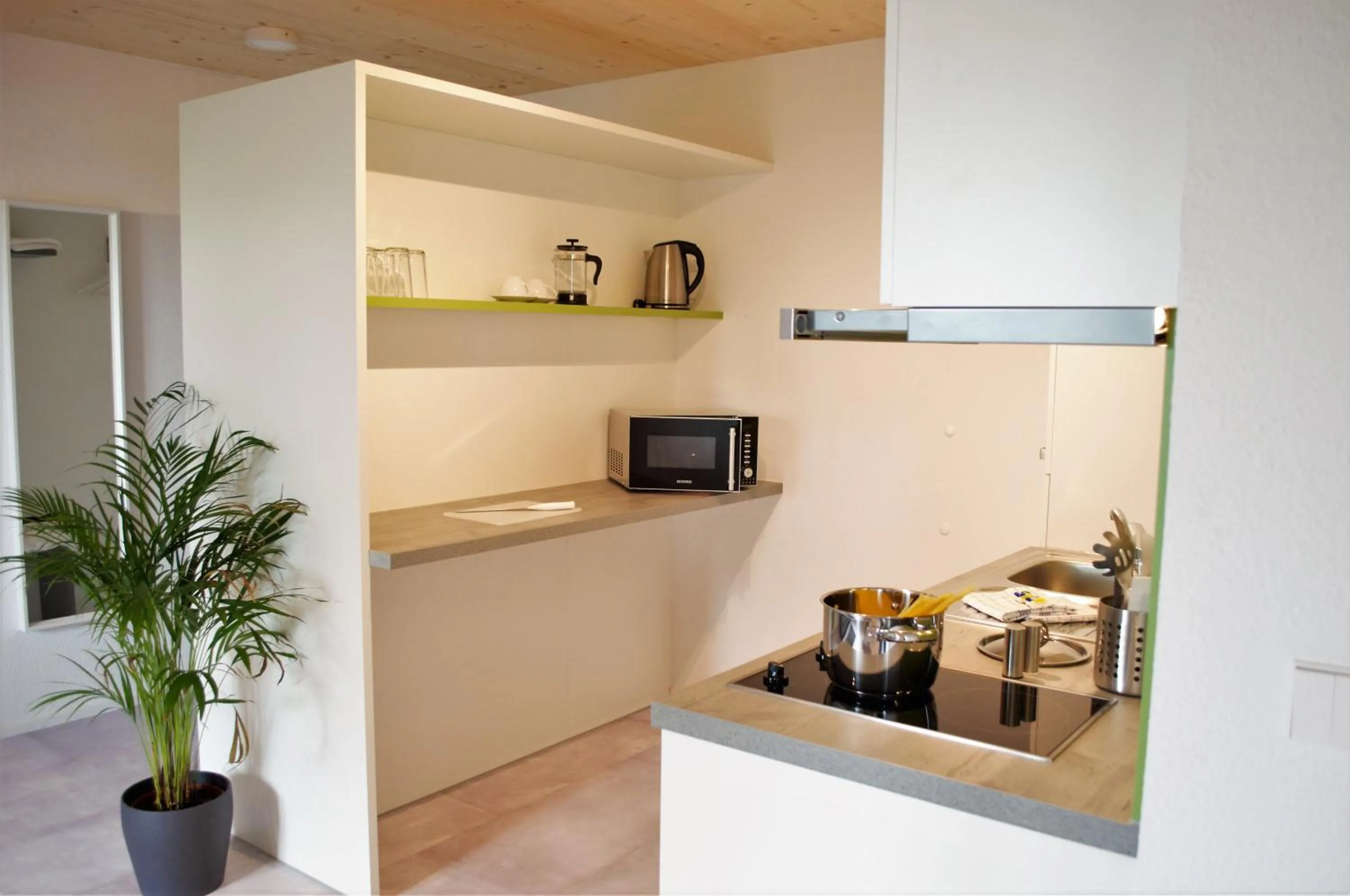 Kitchen or kitchenette in K3 Hotel Weissach Boardinghouse