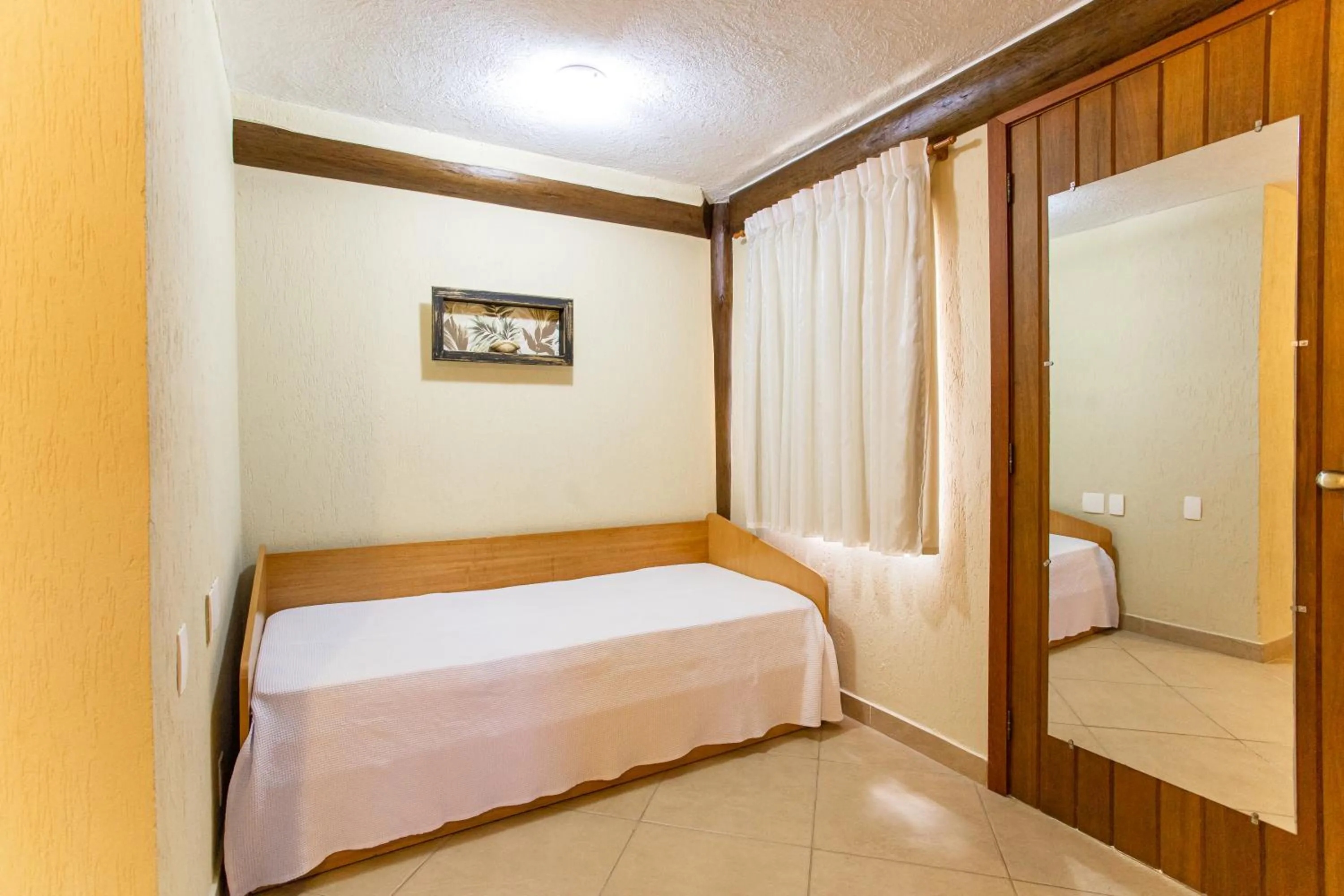 Bed in Pousada Cantagalo