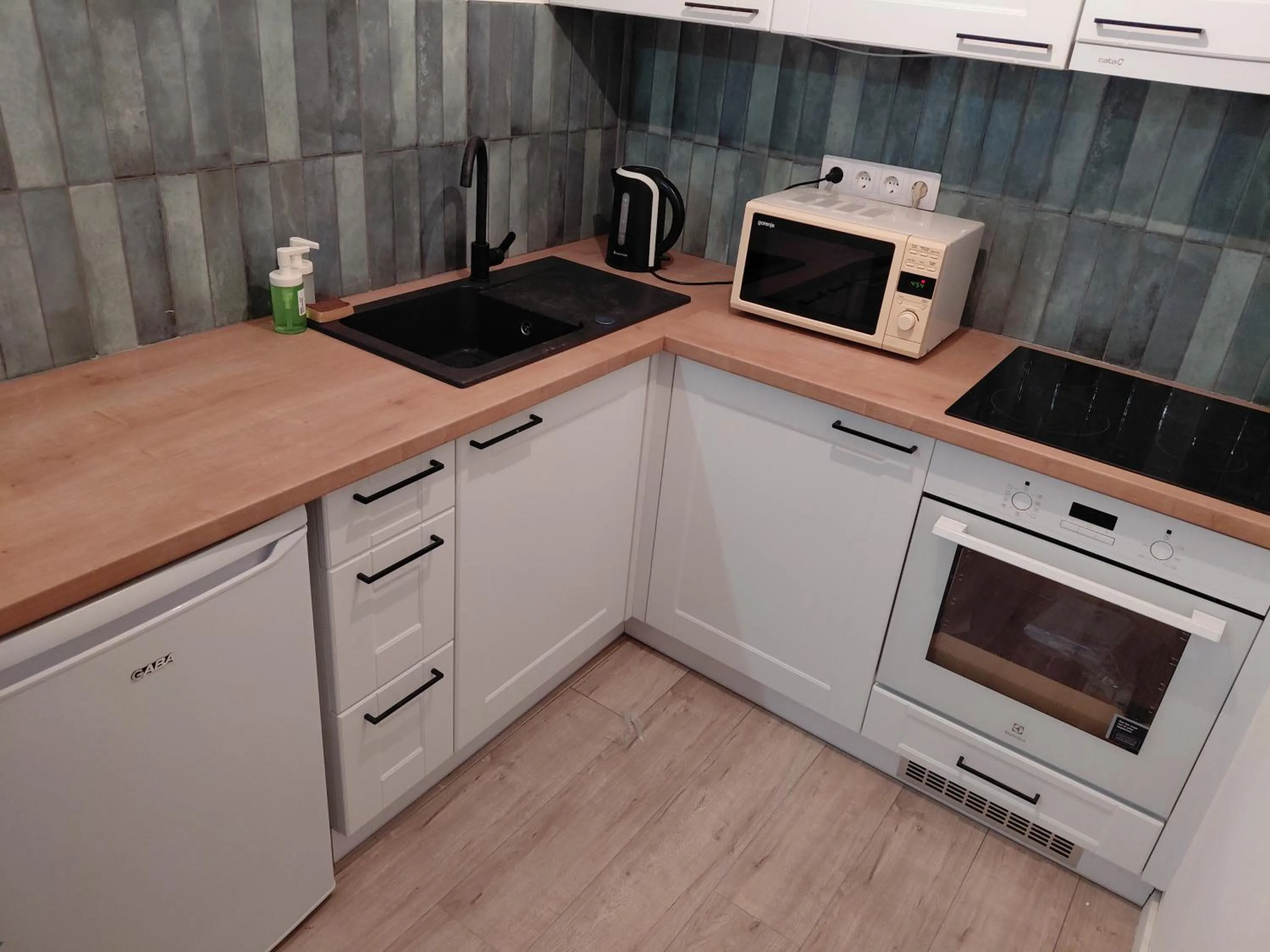 Kitchen or kitchenette in Nova City Apartments