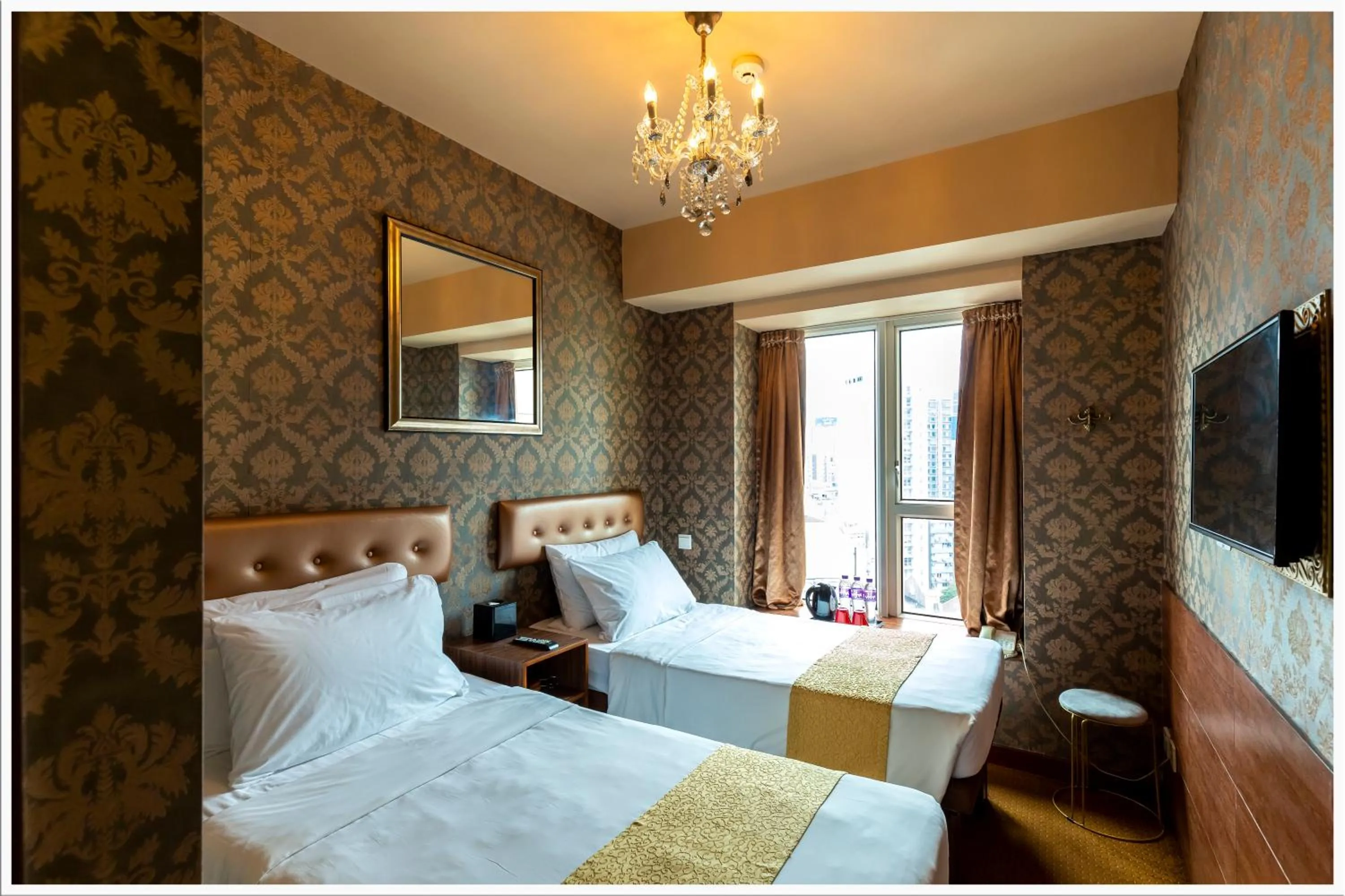 Bed in Ramada Grand Tsim Sha Tsui