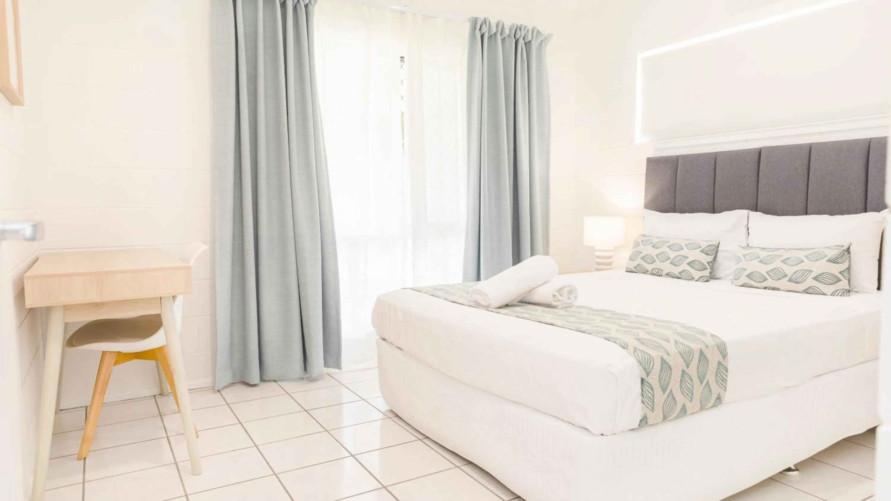 Bed in Palm View Holiday Apartments