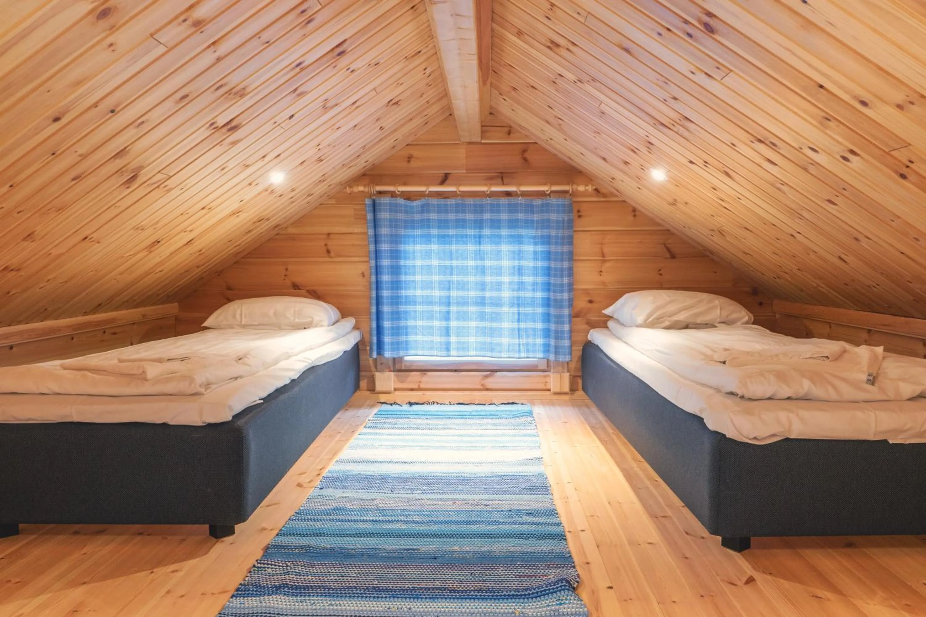 Bed in Harriniva Adventure Resort Cabins