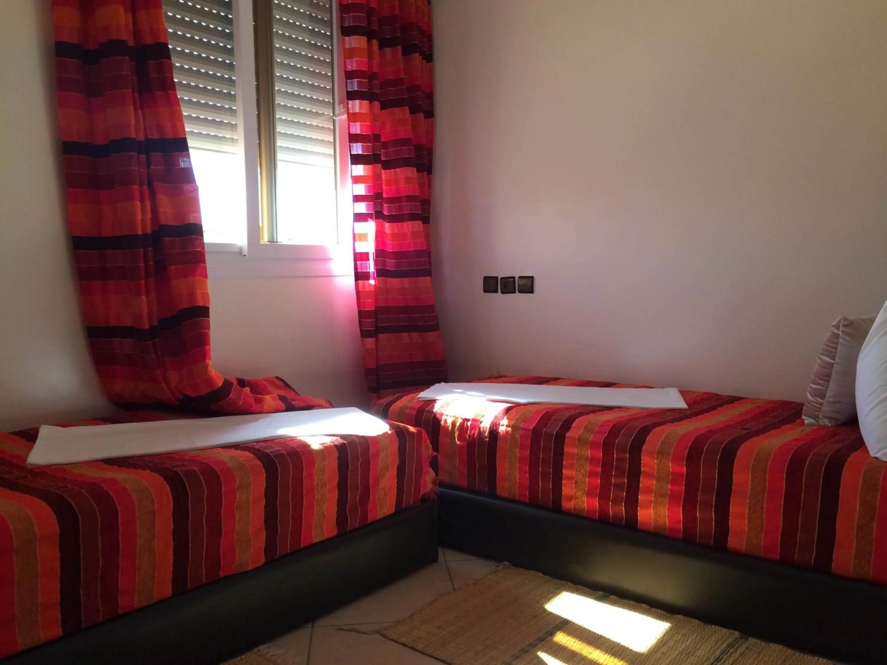 Bed in ITRANE GUEST HOUSE