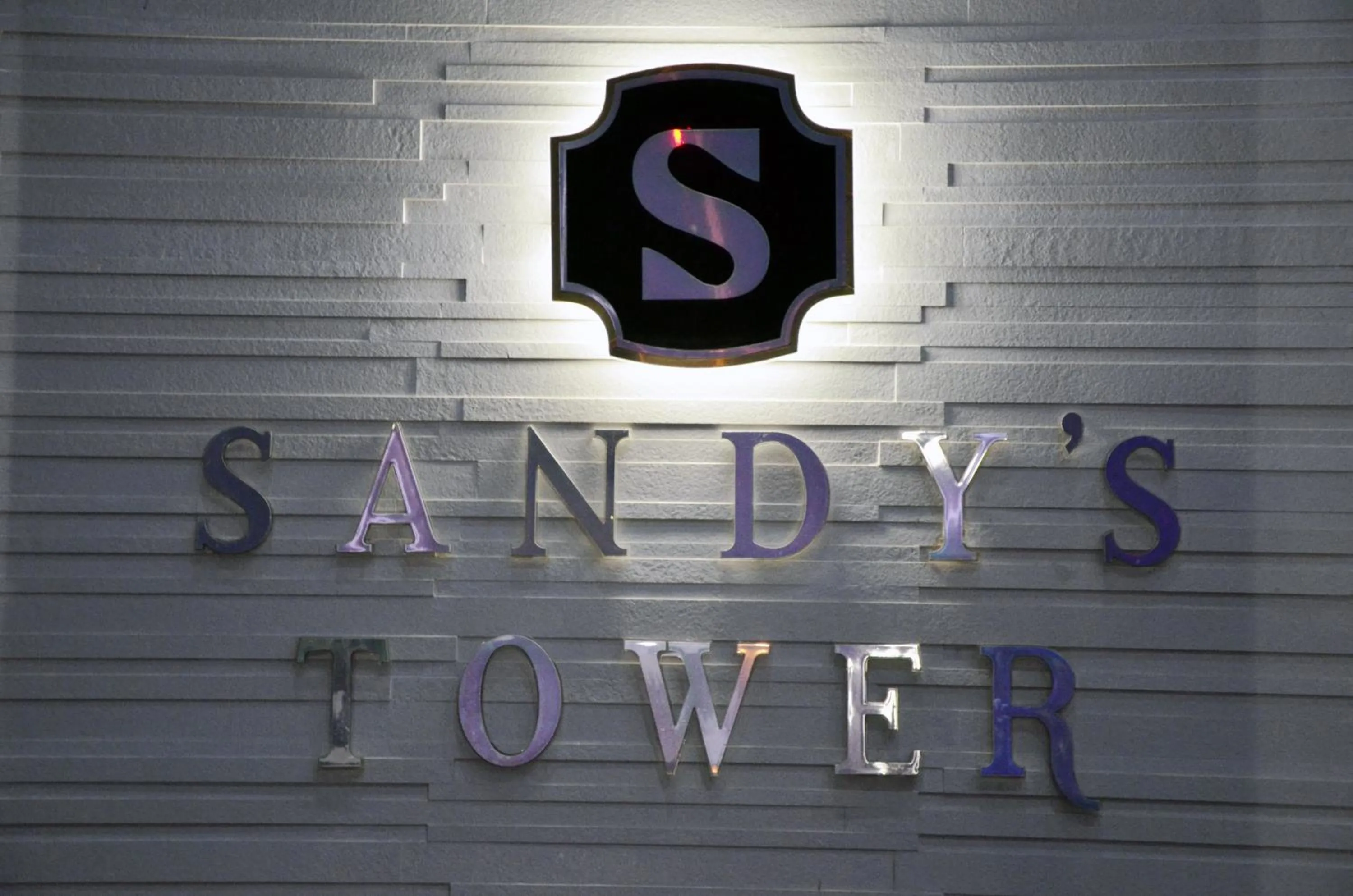 Property logo or sign in Hotel Sandy's Tower