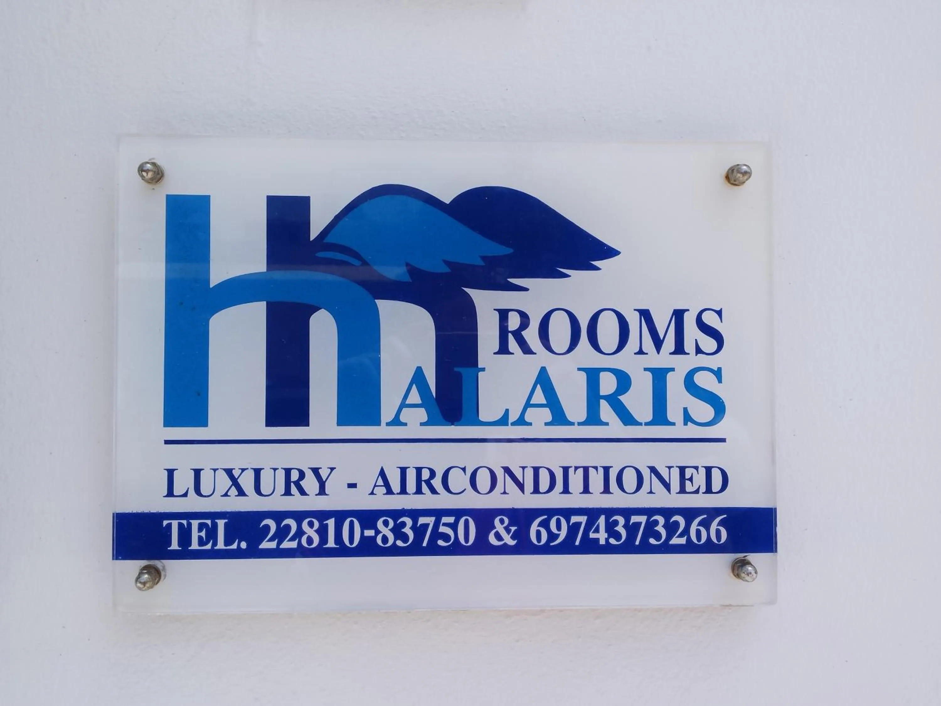 Property logo or sign in Halaris Rooms