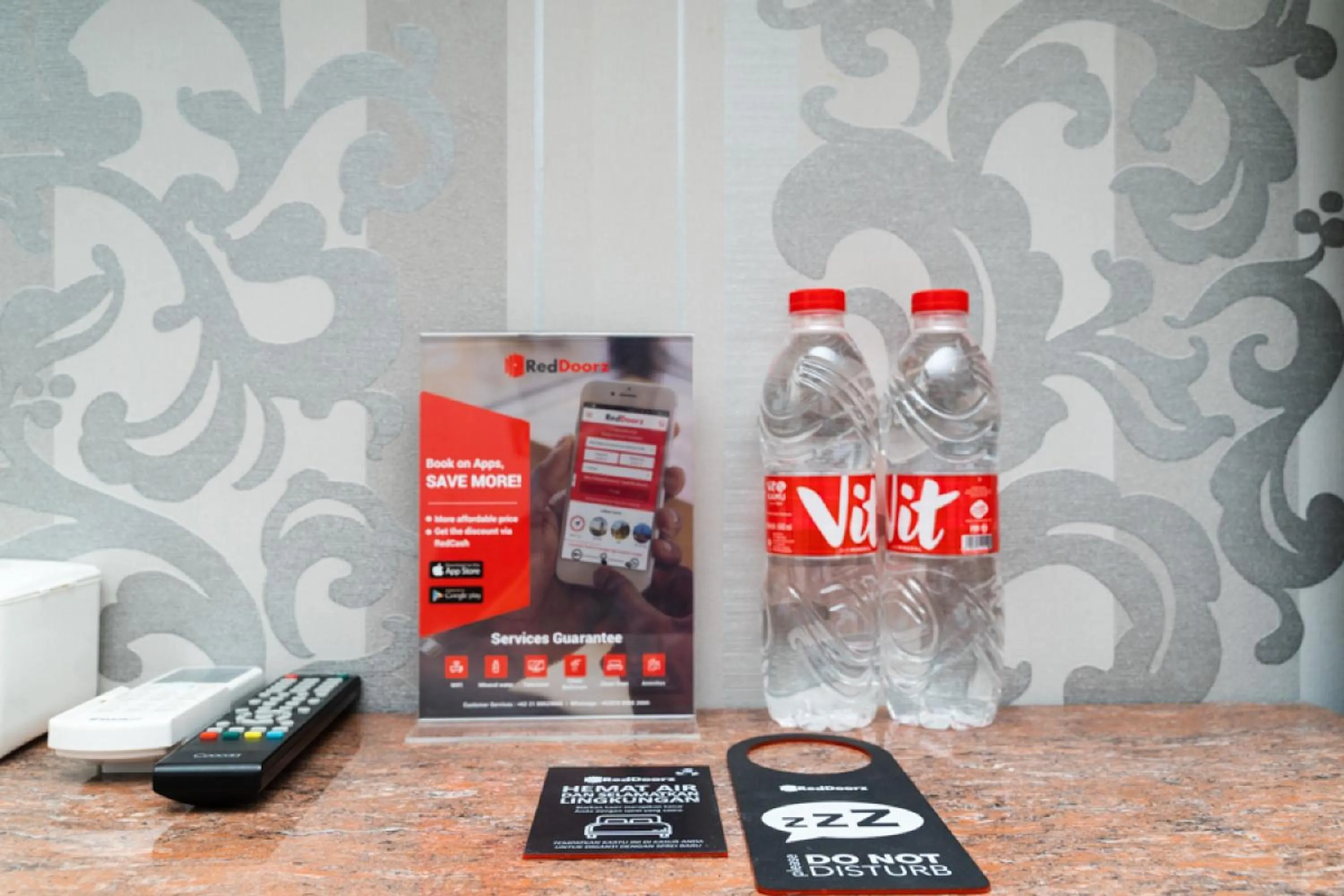 Property logo or sign in RedDoorz Apartment at Bogor Valley