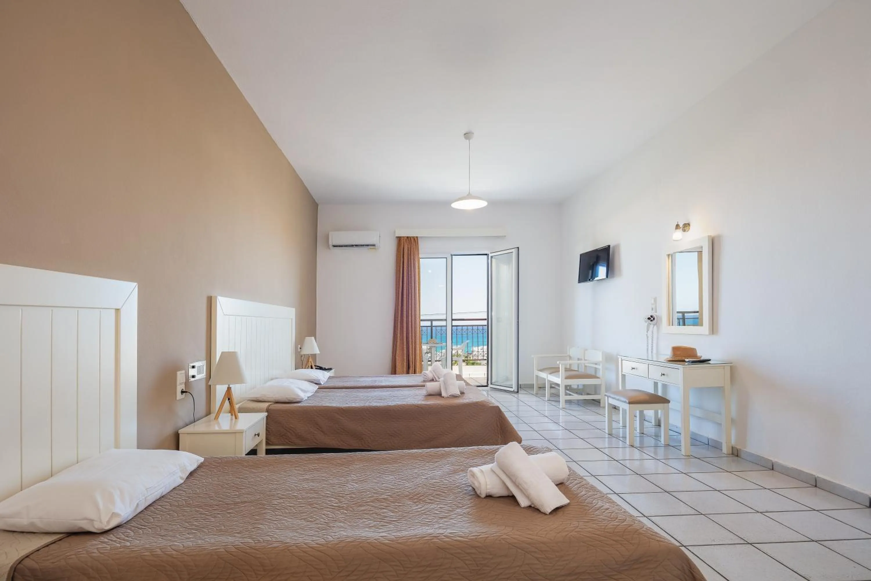 Bed in Koni Village Hotel