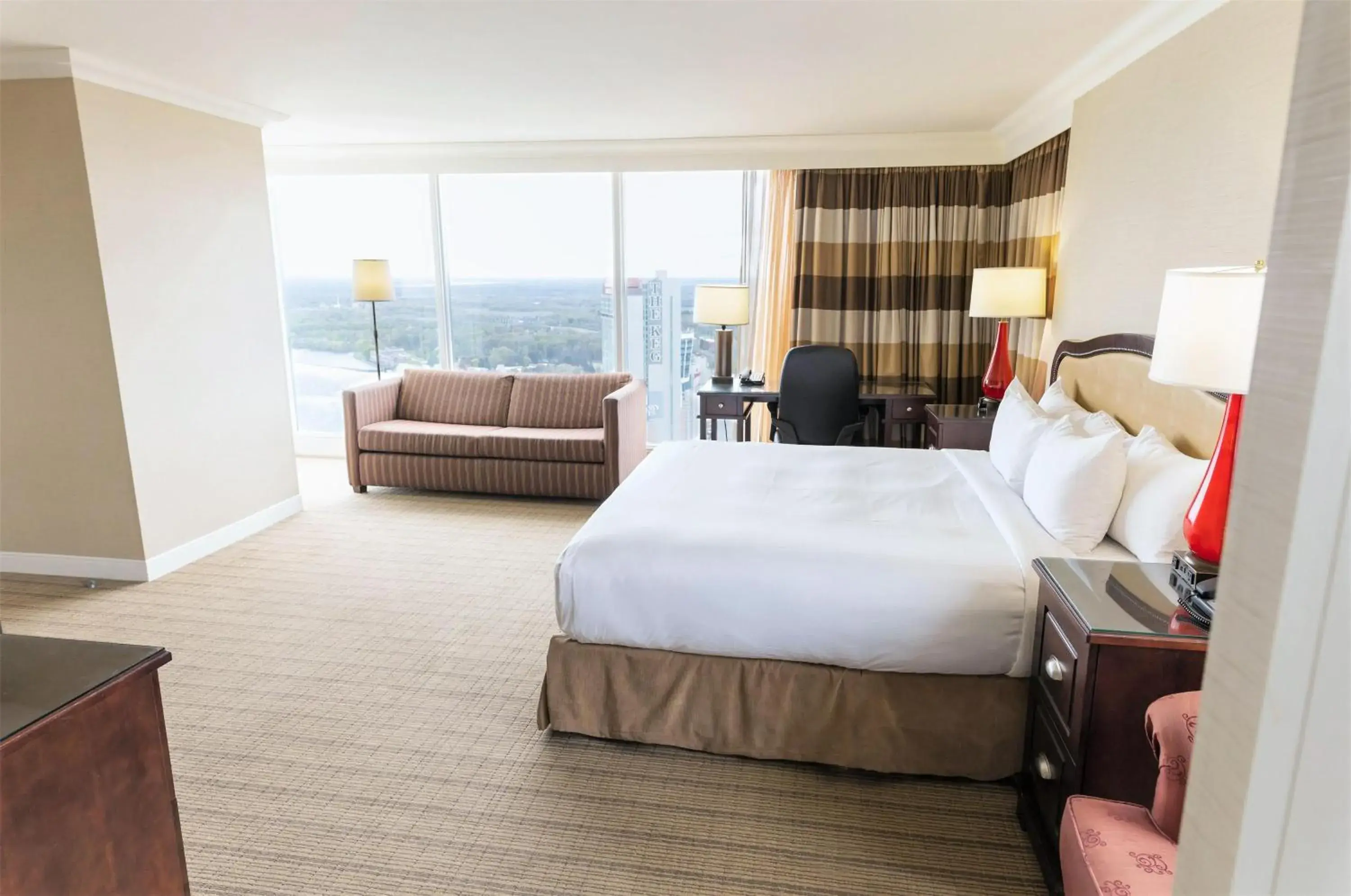 Living room, Bed in Hilton Niagara Falls/ Fallsview Hotel and Suites Living room, Bed in Hilton Niagara Falls/ Fallsview Hotel and Suites