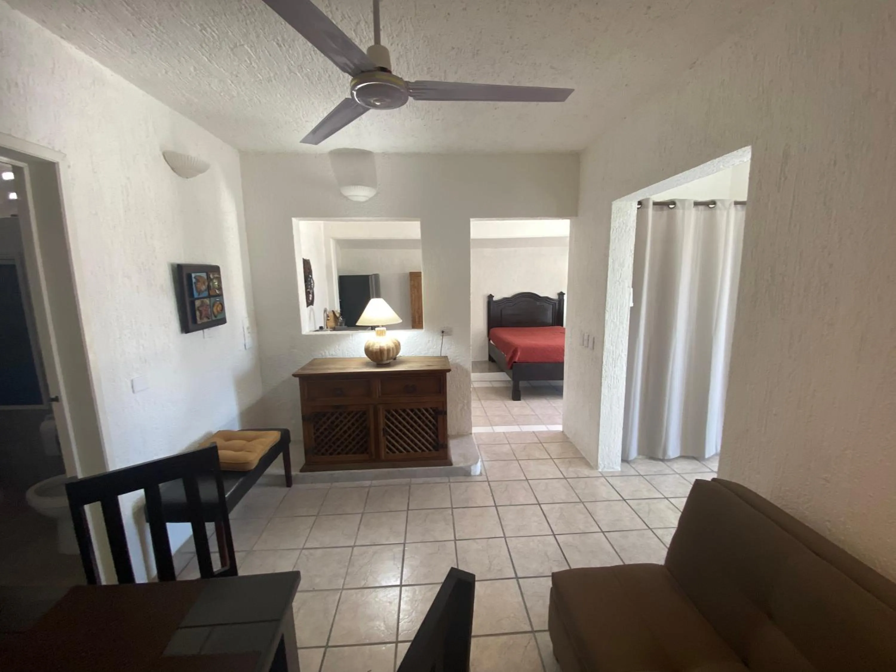 Seating area, Bed in Caribo Cozumel